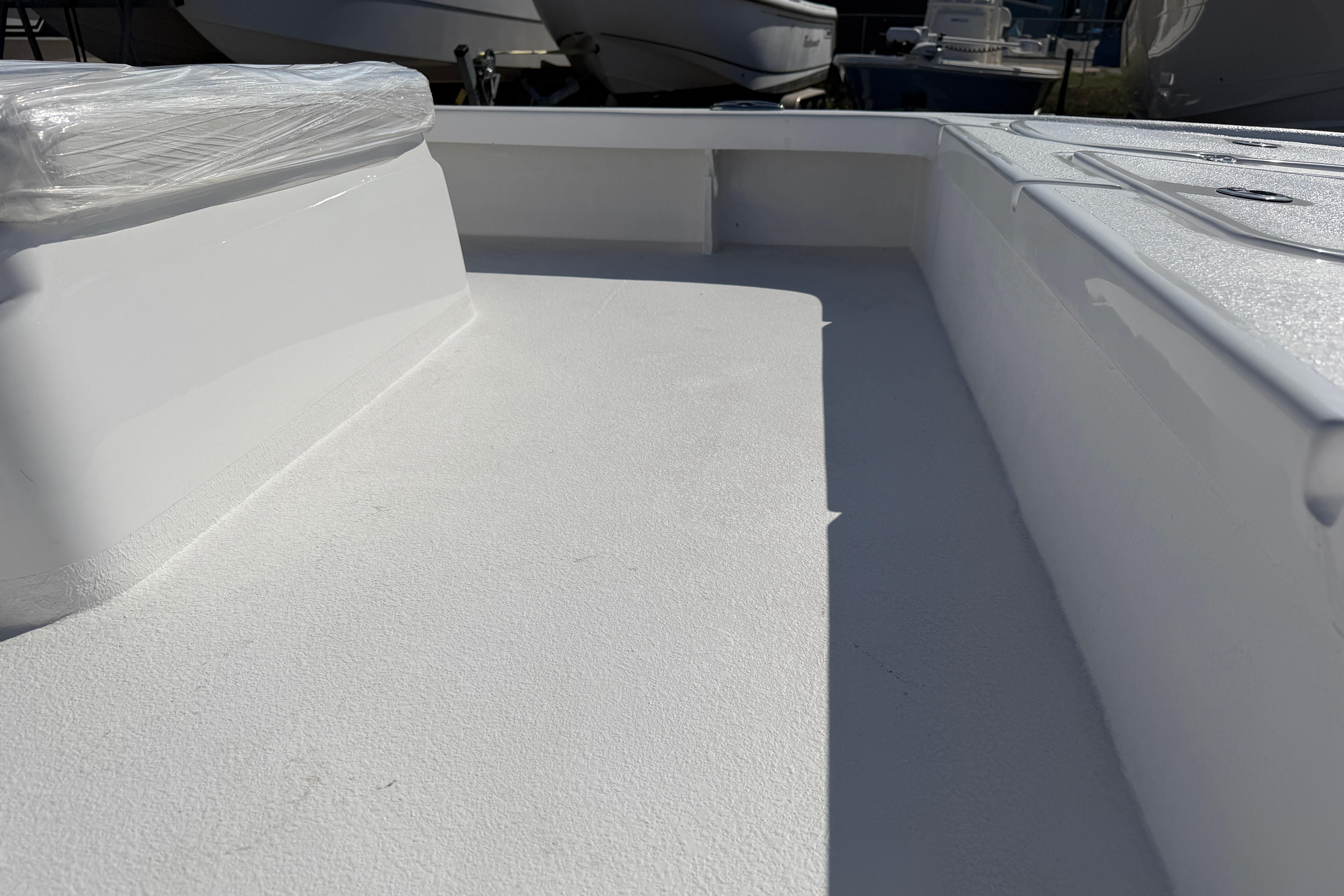 2026 Skuta 24 Cat boat interior with sleek white deck design.