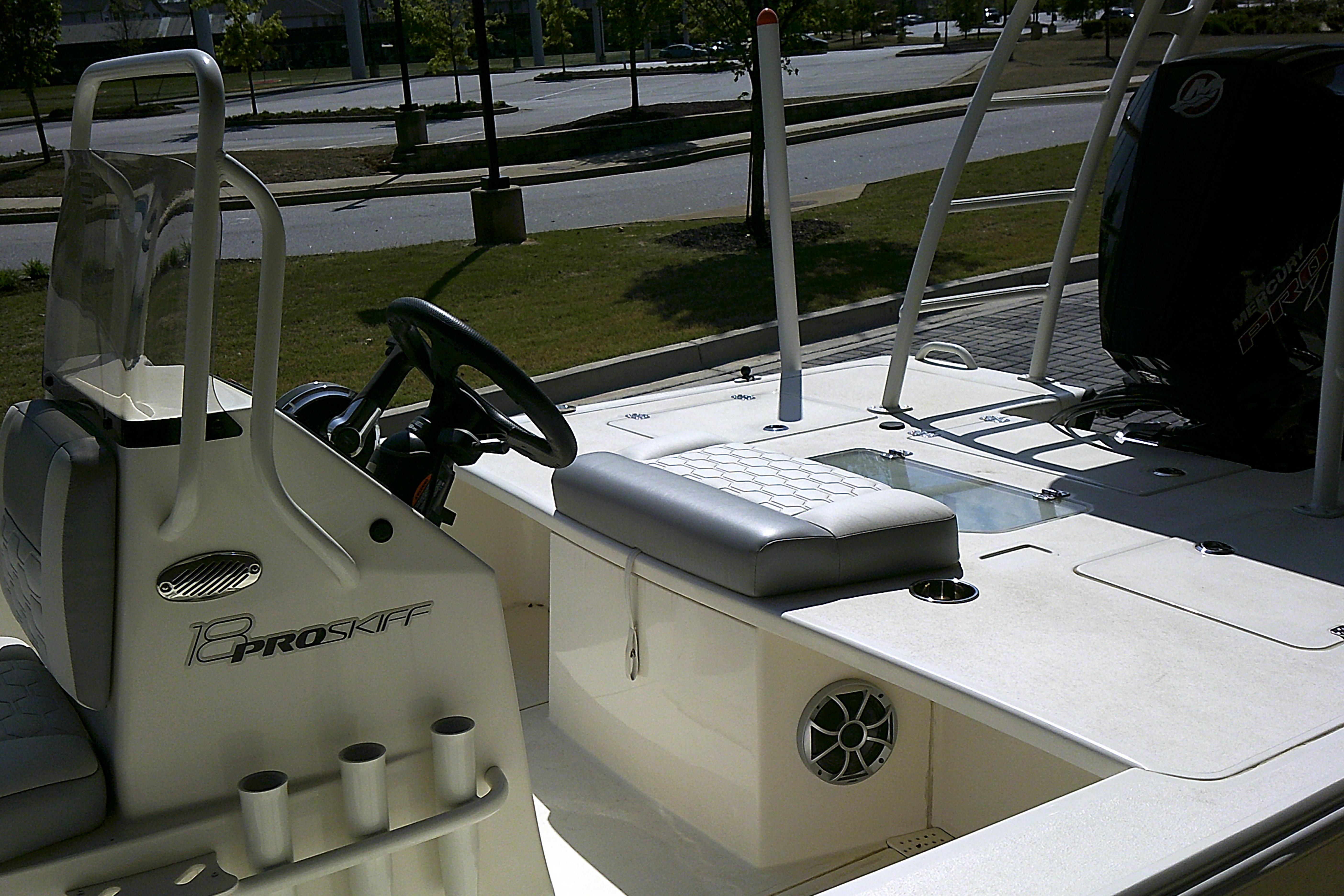 2026 Mako 18 Pro Skiff boat interior with steering console and seating.