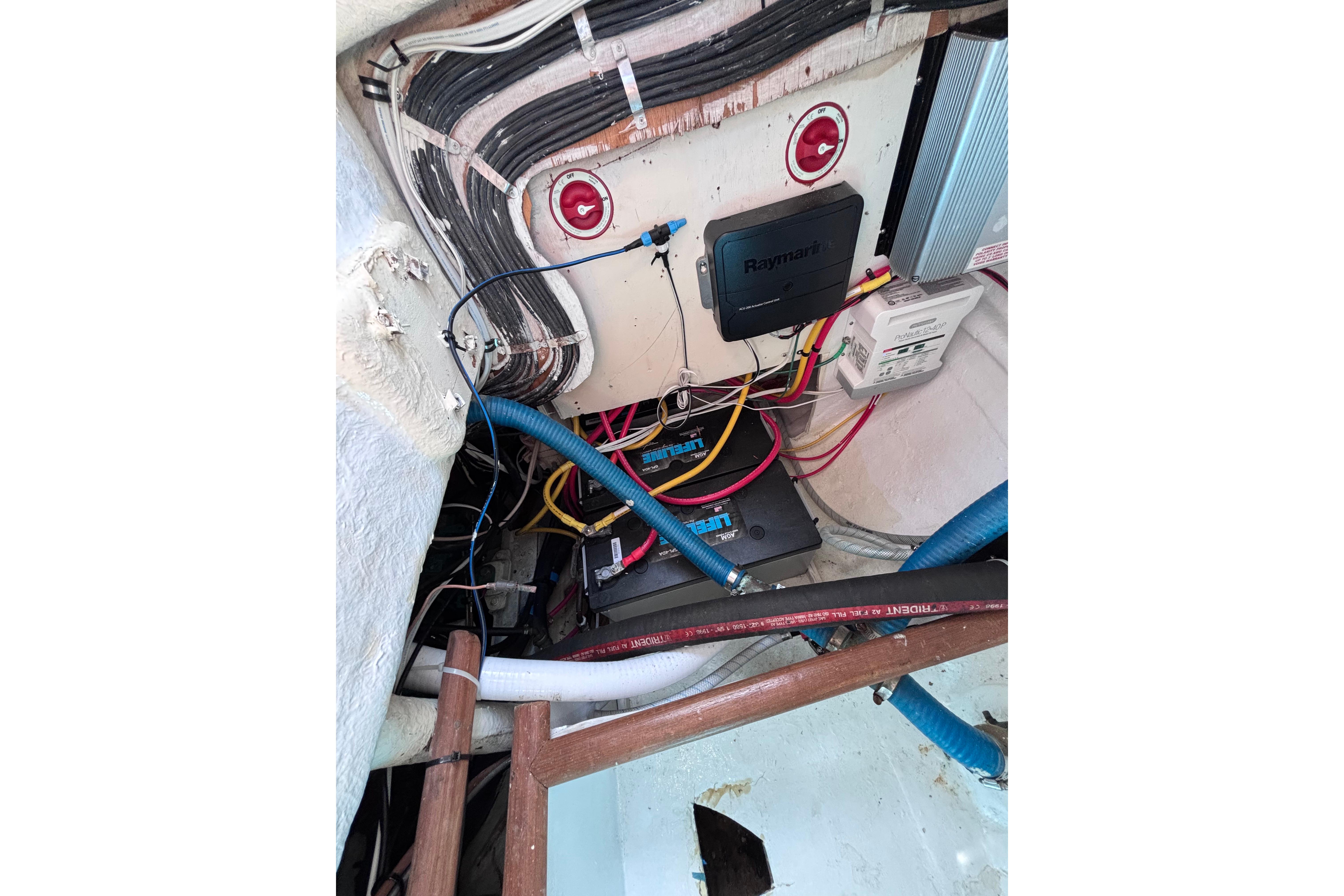 Electrical wiring and components inside a 1978 Swift 33 boat.