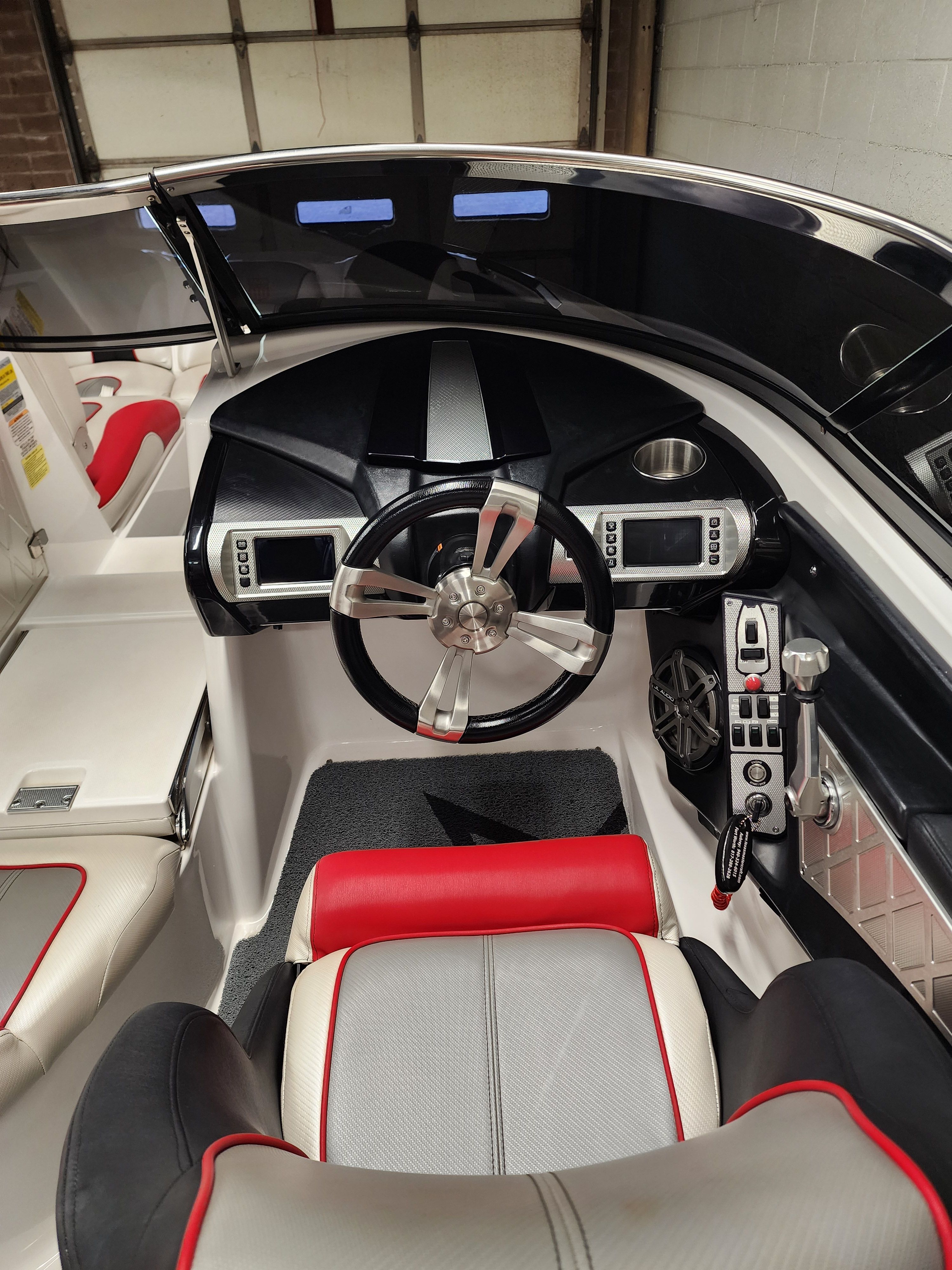 Interior of a 2013 MasterCraft XStar boat with modern dashboard.