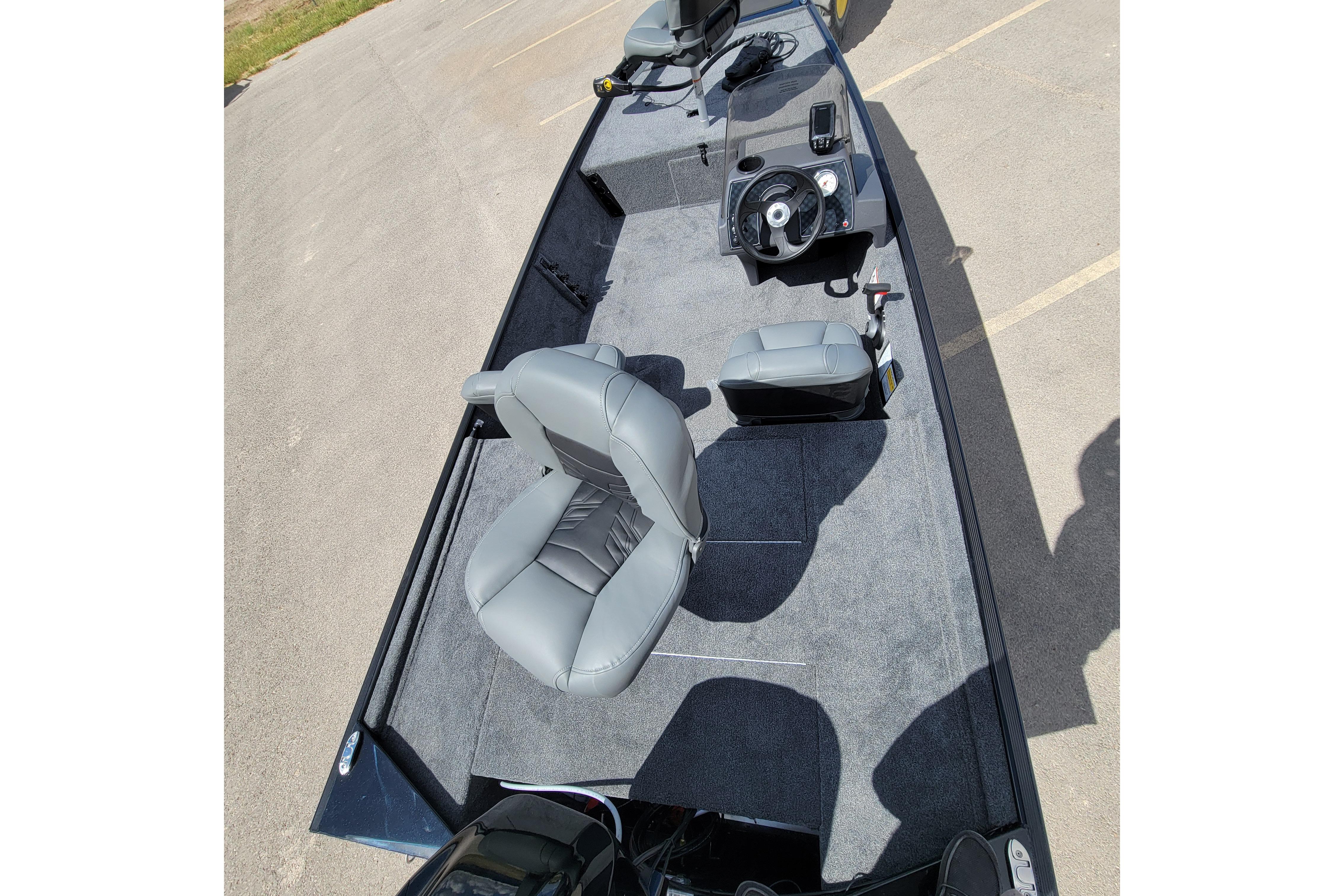 2026 Tracker Bass Tracker Classic XL boat interior with gray seating and steering console.