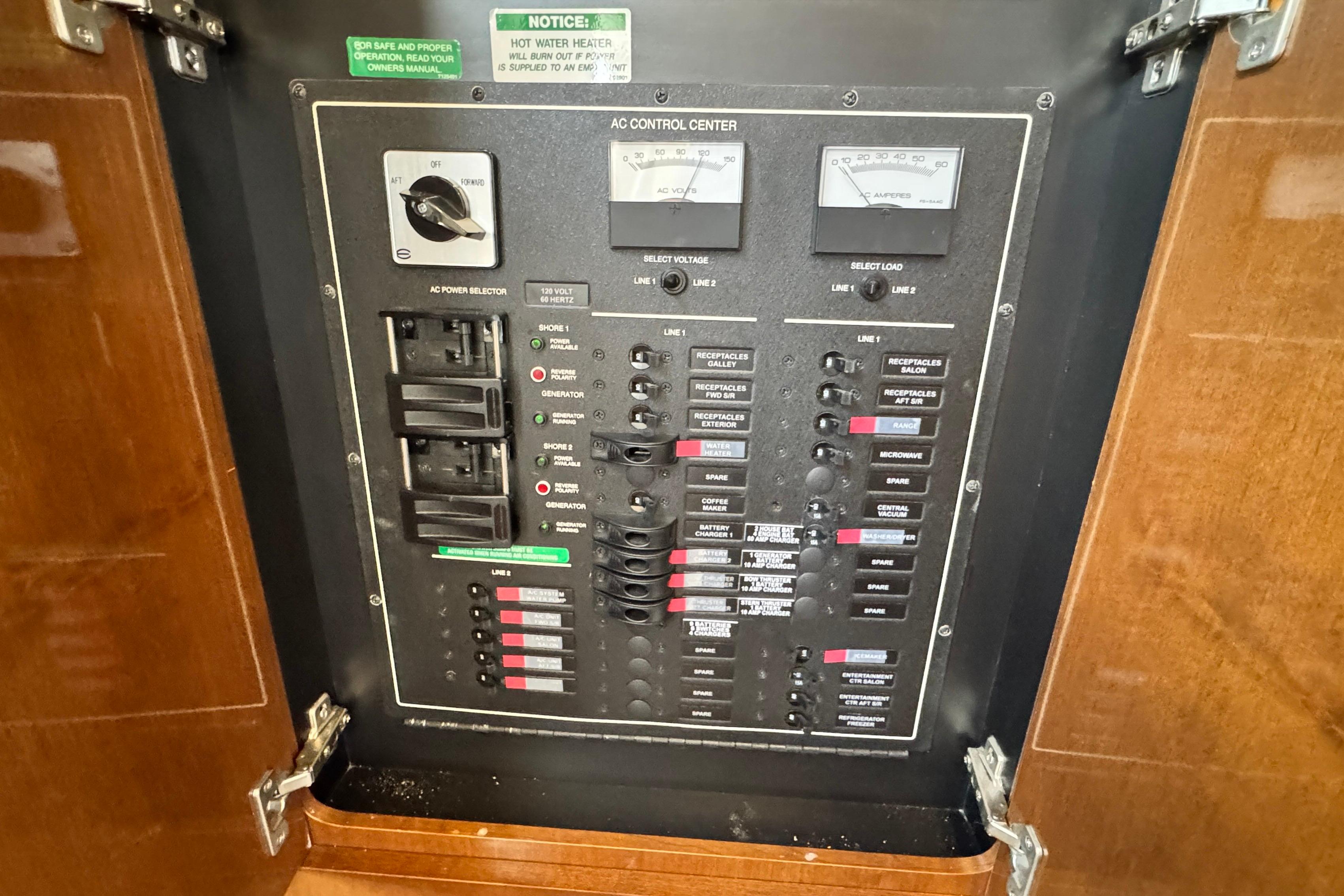 Electrical control panel on a 2007 Carver 47 Motor Yacht, featuring switches and meters.