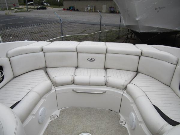2004 Ebbtide 22 Mystique boat interior with white cushioned seating.