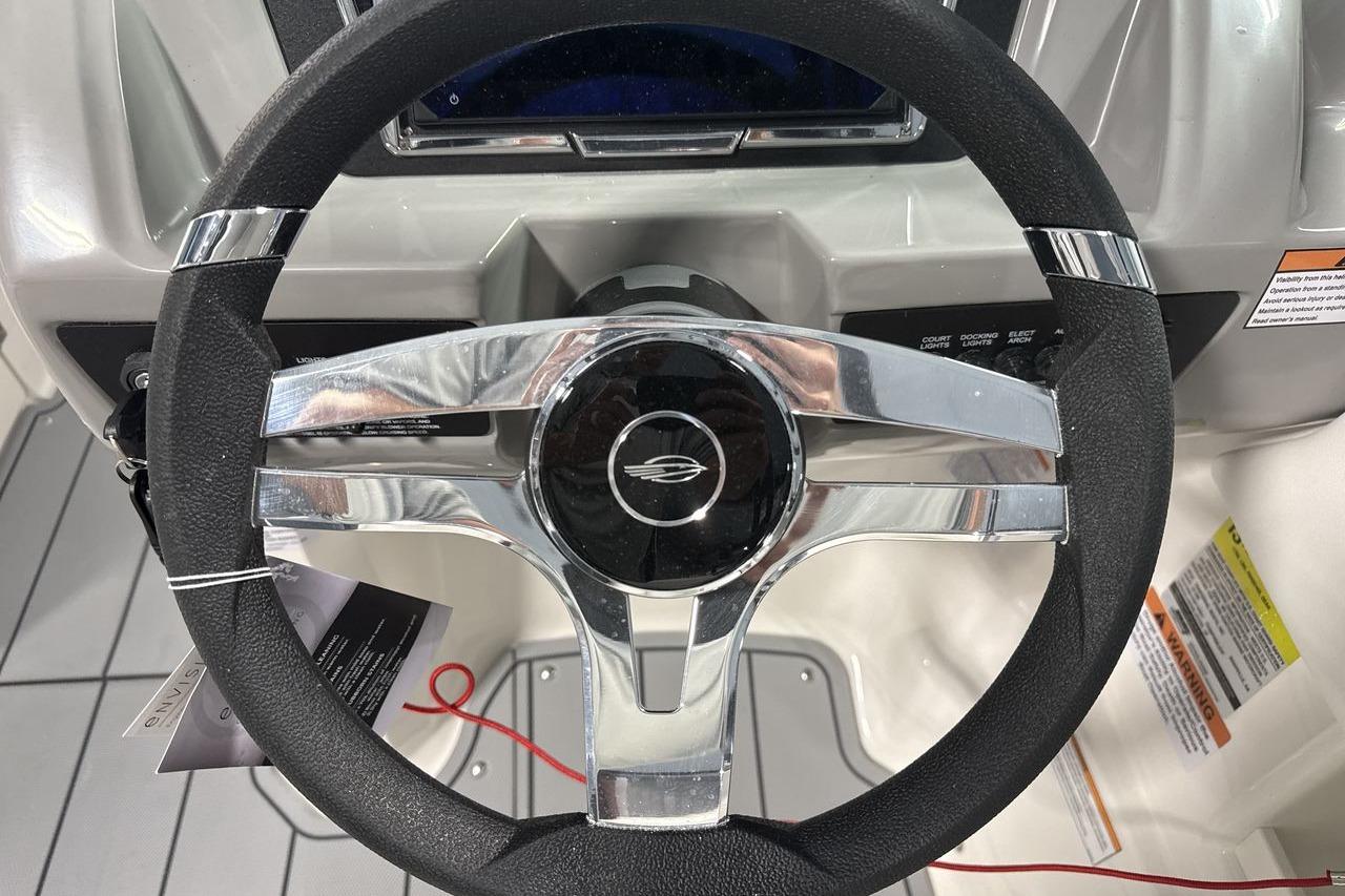 The image shows the steering wheel of a 2026 Chaparral 23 SSi boat.