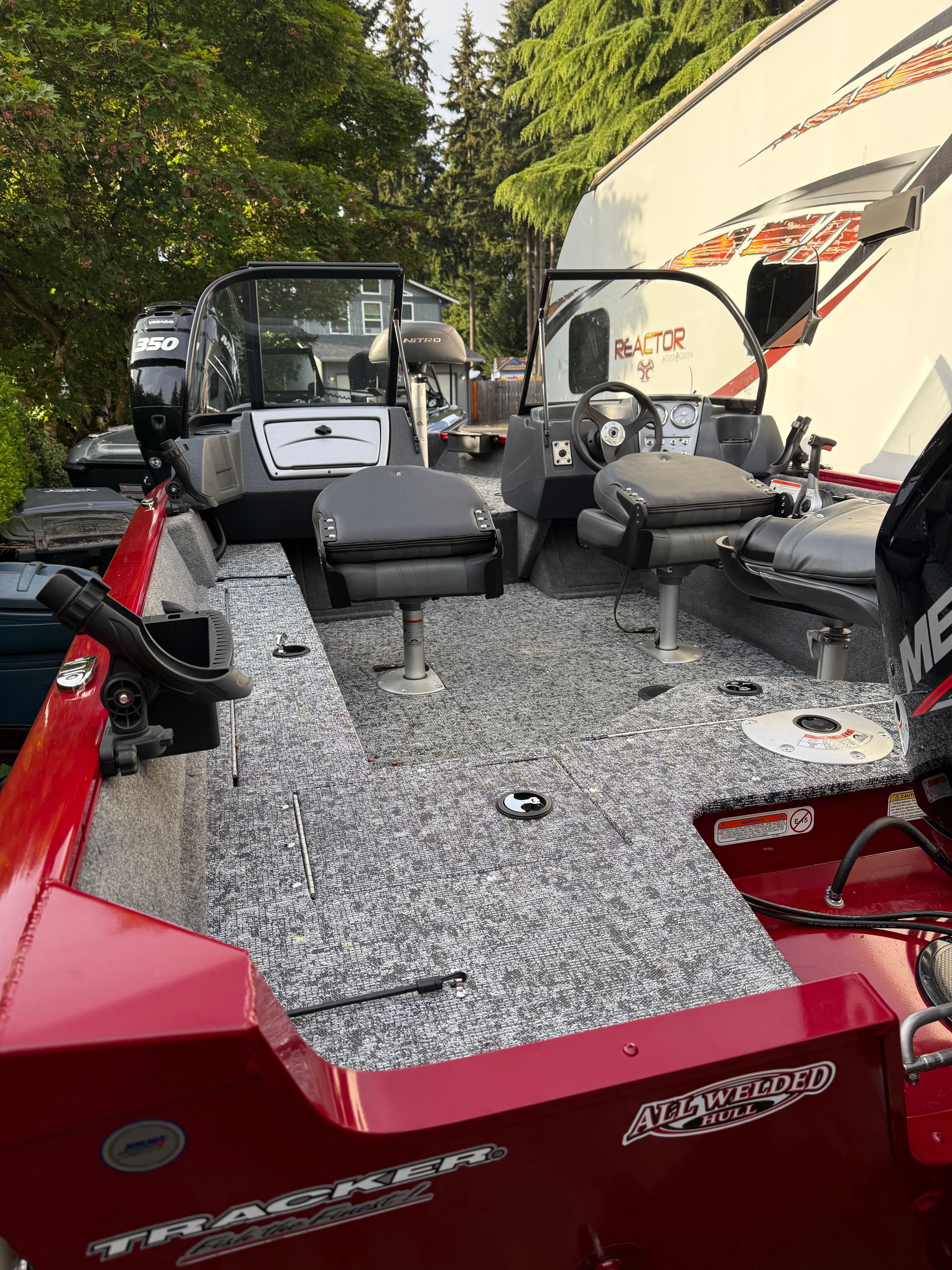 2025 Tracker Pro Guide V-16 WT boat with gray interior.