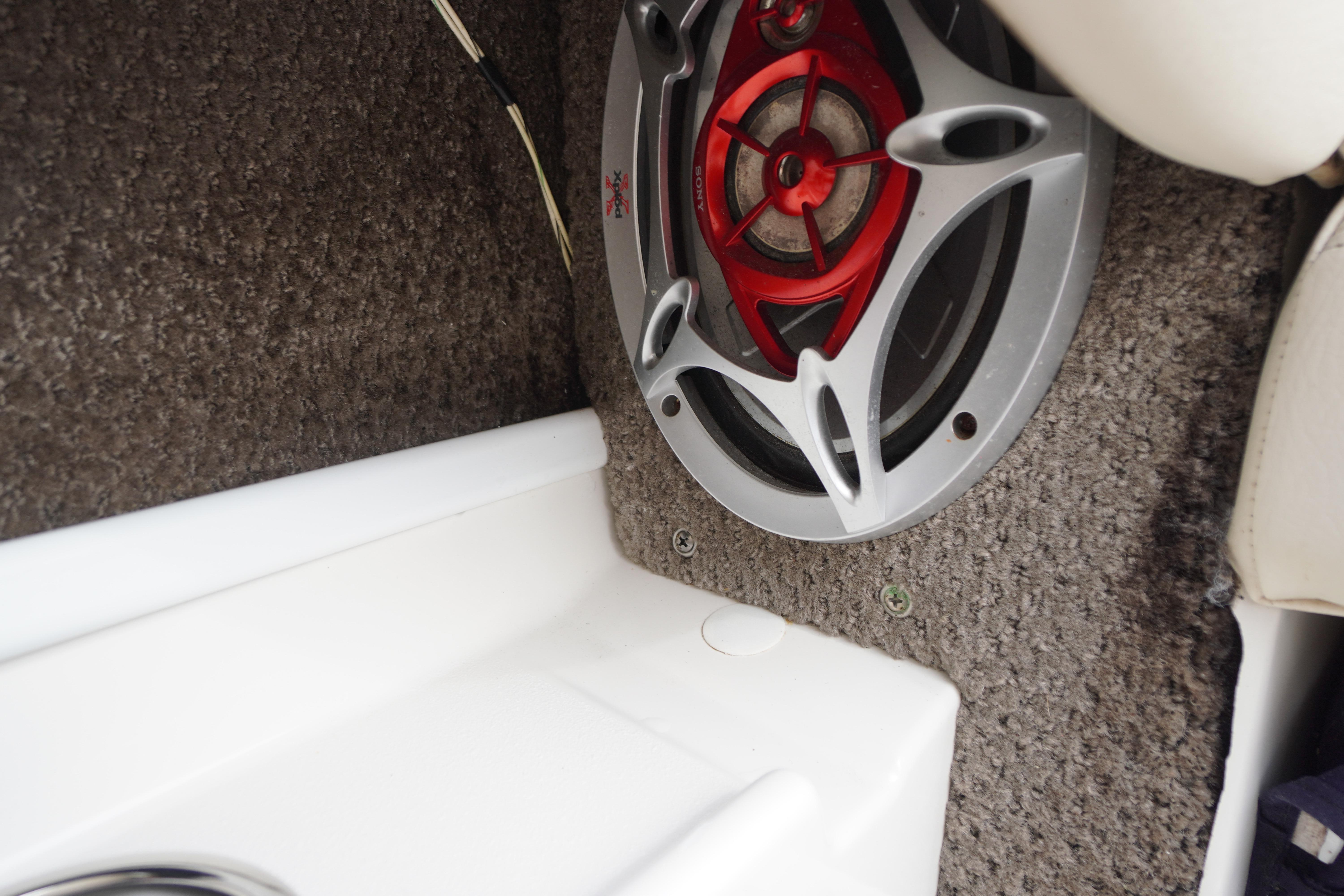 Speaker system in 2005 Chris Craft Speedster Heritage boat interior, featuring red and silver design.