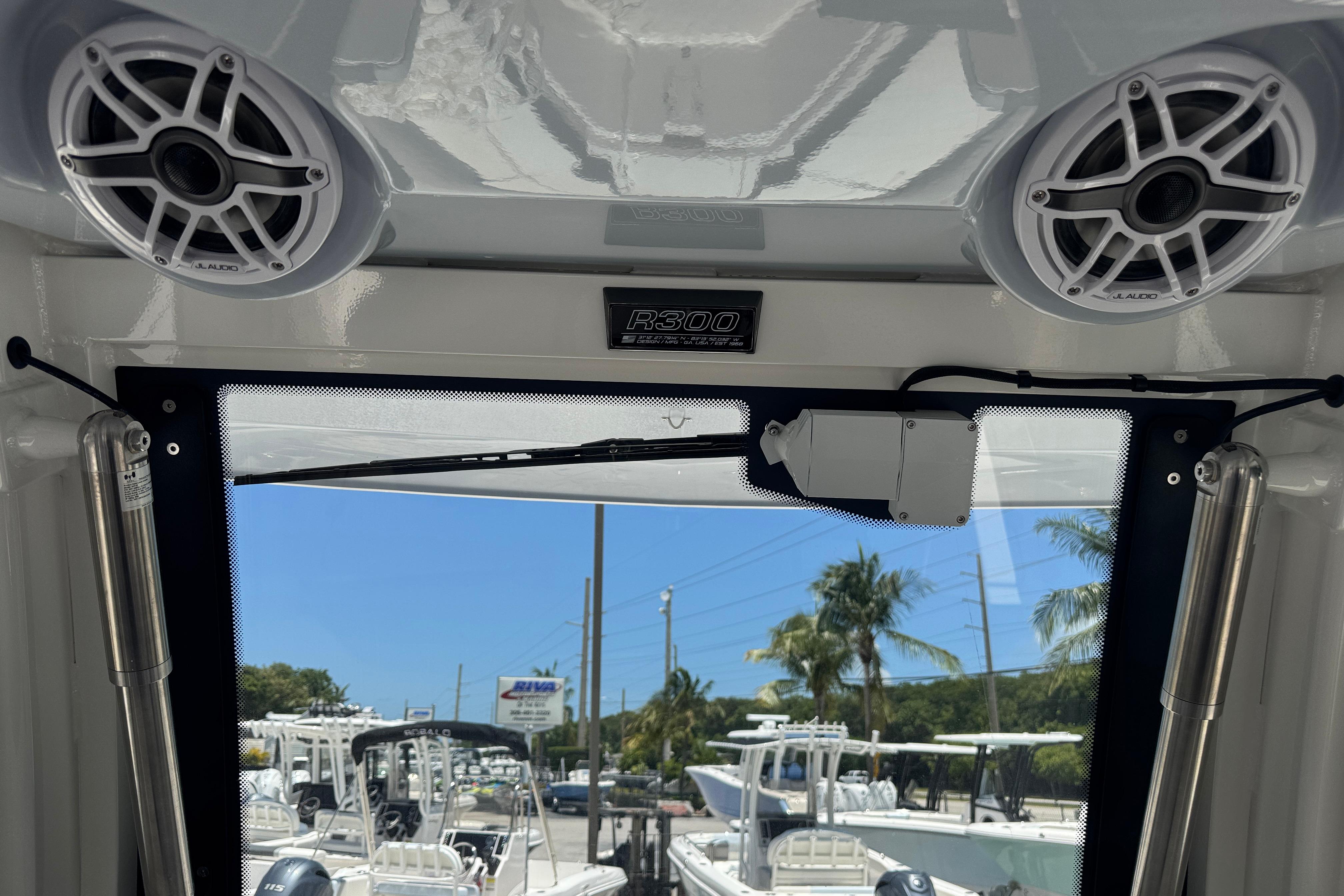 2025 Robalo R300 Center Console interior with speakers and windshield view.