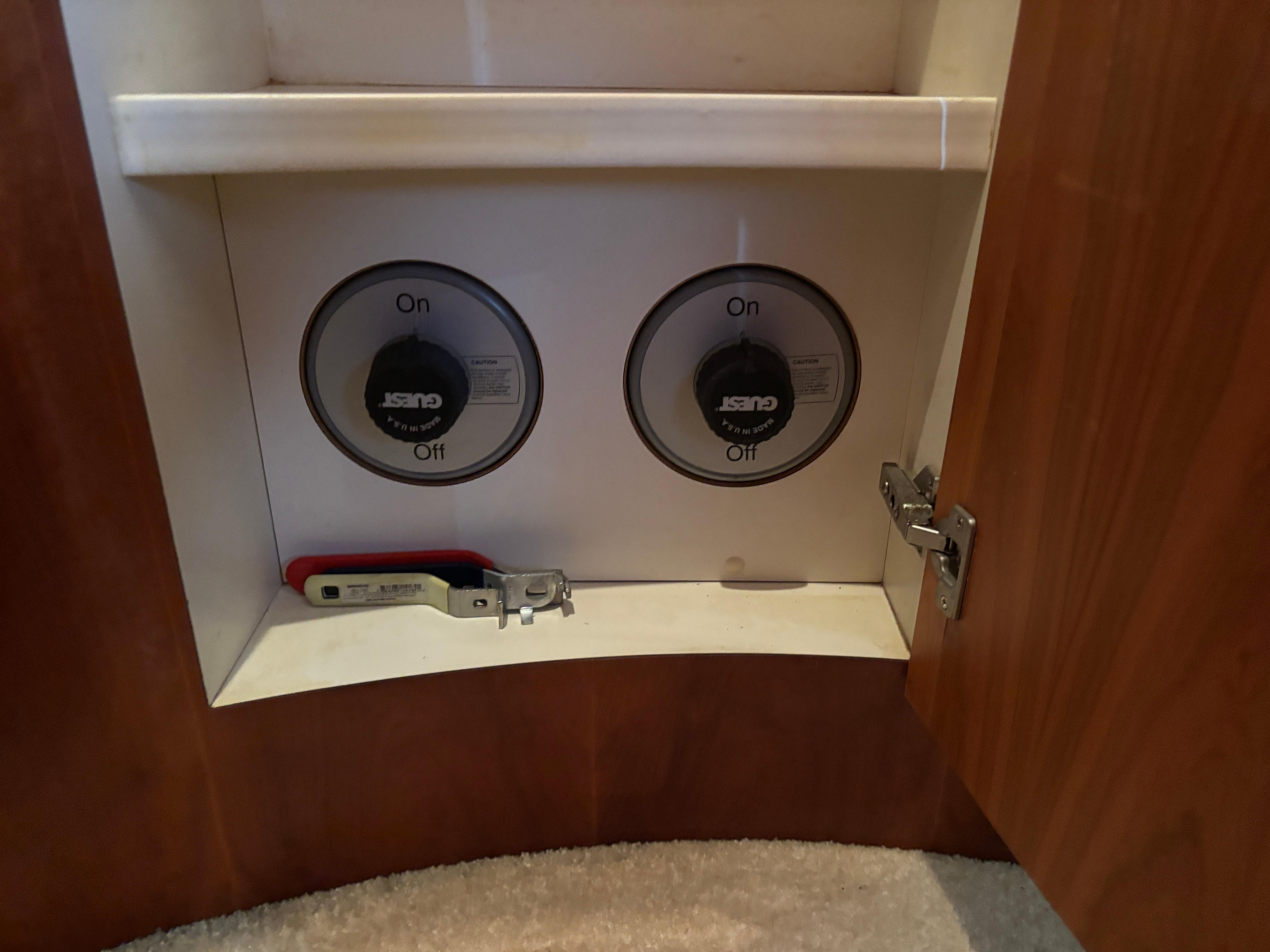 Control panel inside a 2001 Silverton 410 Sport Bridge boat cabinet.