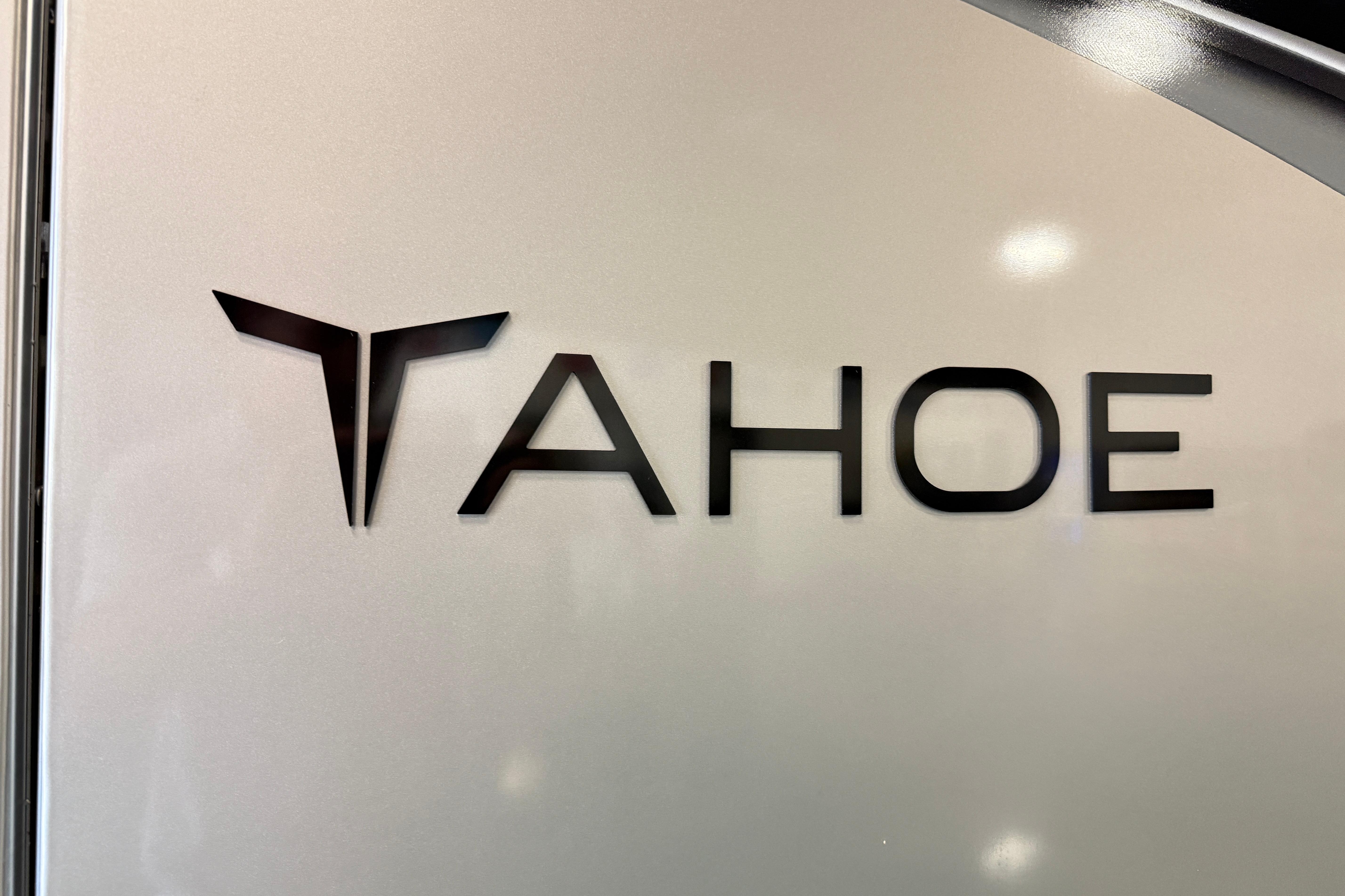 2026 Tahoe Pontoon LTZ Entertainer logo on sleek metallic surface.