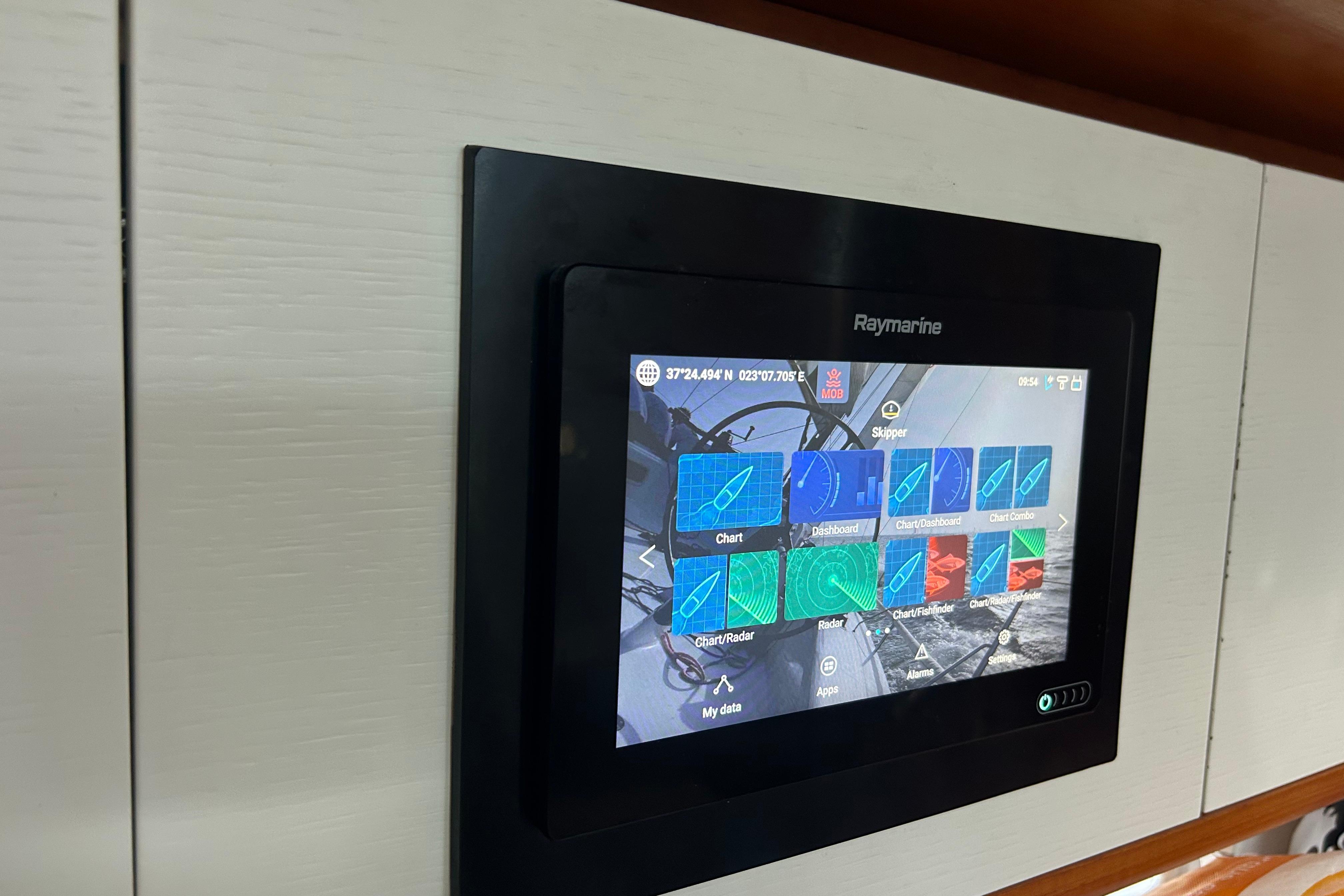 Raymarine navigation display on 2013 Italia Yachts IY13.98, showing charts and radar interface.