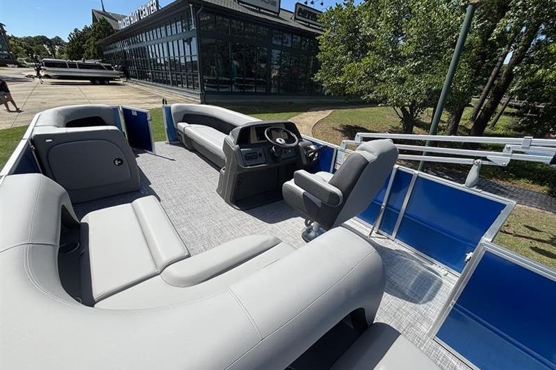 2026 Sun Tracker Party Barge 18 DLX pontoon boat with spacious seating and modern helm.