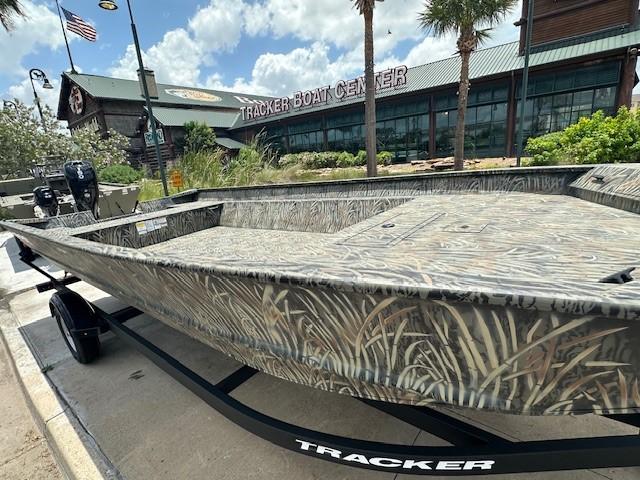2025 Tracker GRIZZLY 2072 Utility boat at Tracker Boat Center, camo design.