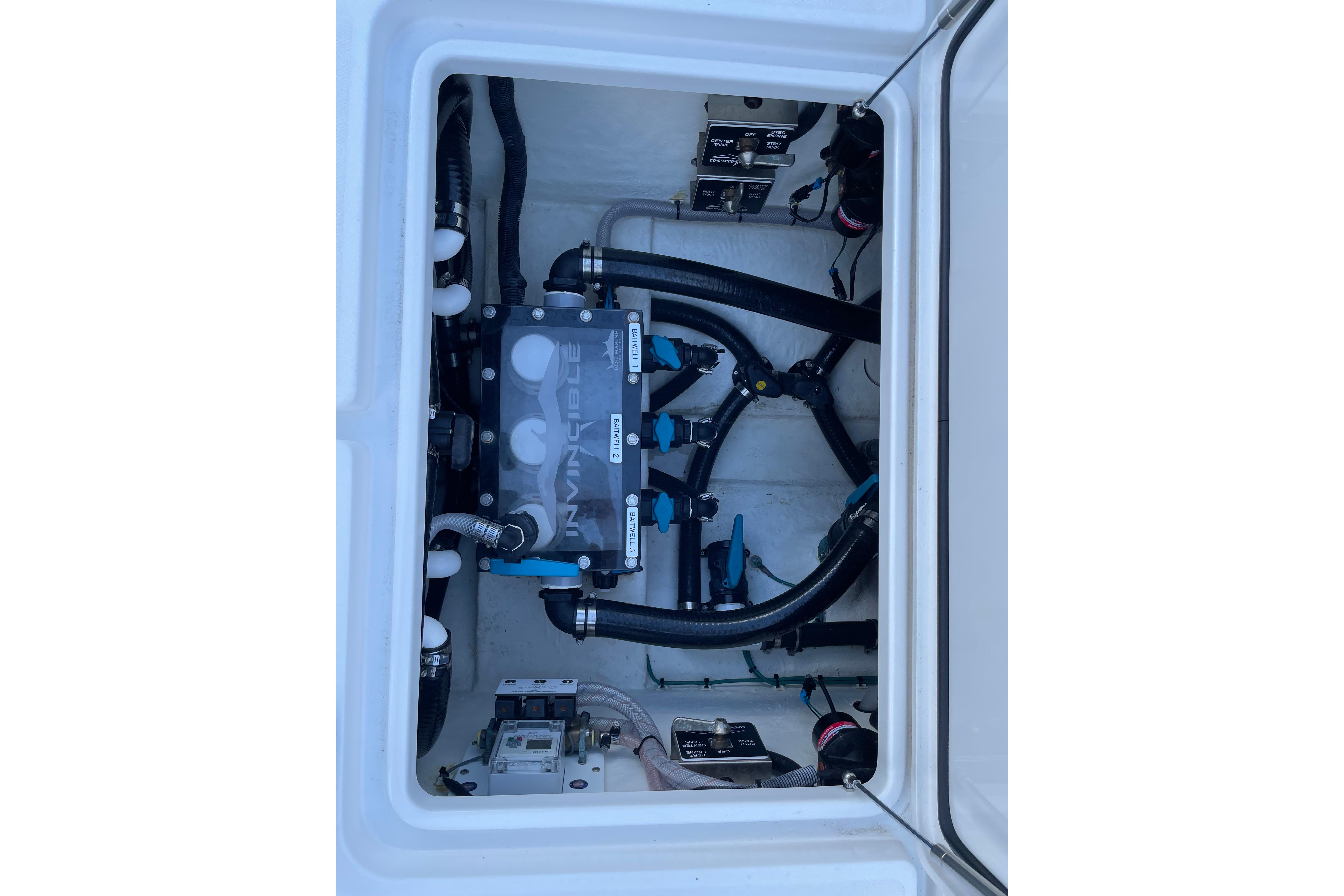 2024 Invincible 36 Open Fisherman boat plumbing system with hoses and valves.