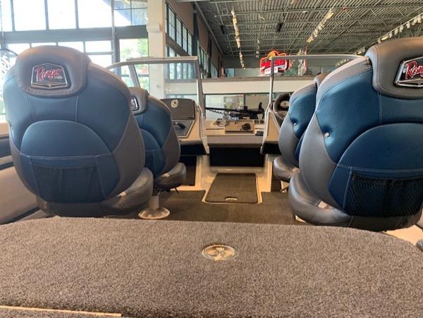 2024 Ranger 1850MS boat interior with blue and black seats in showroom.