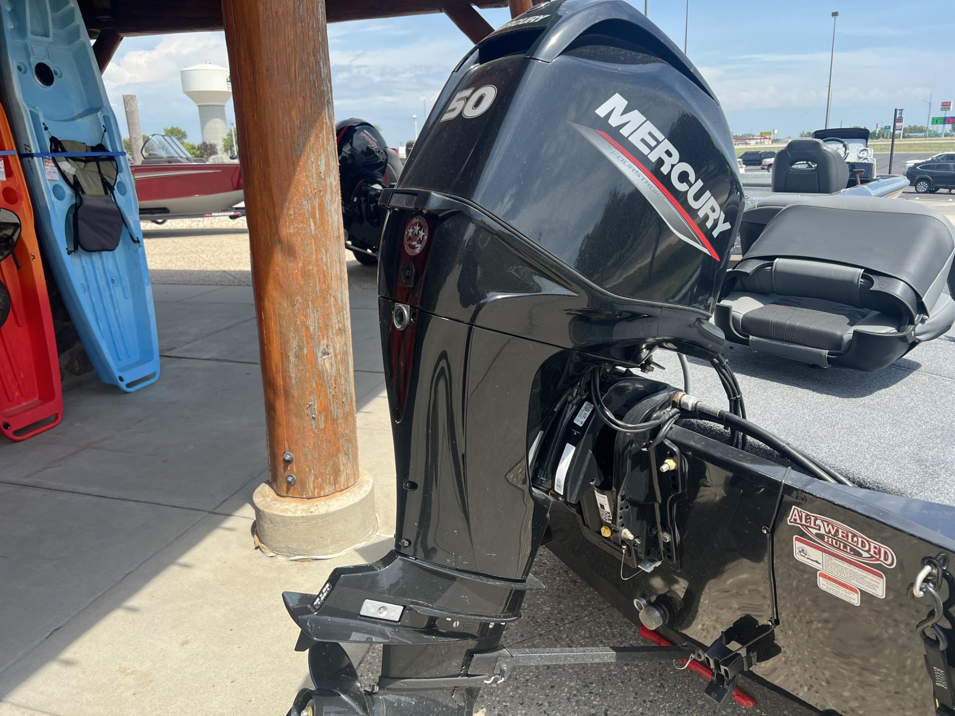 2025 Tracker Bass Tracker Classic XL with Mercury outboard motor, displayed outdoors.