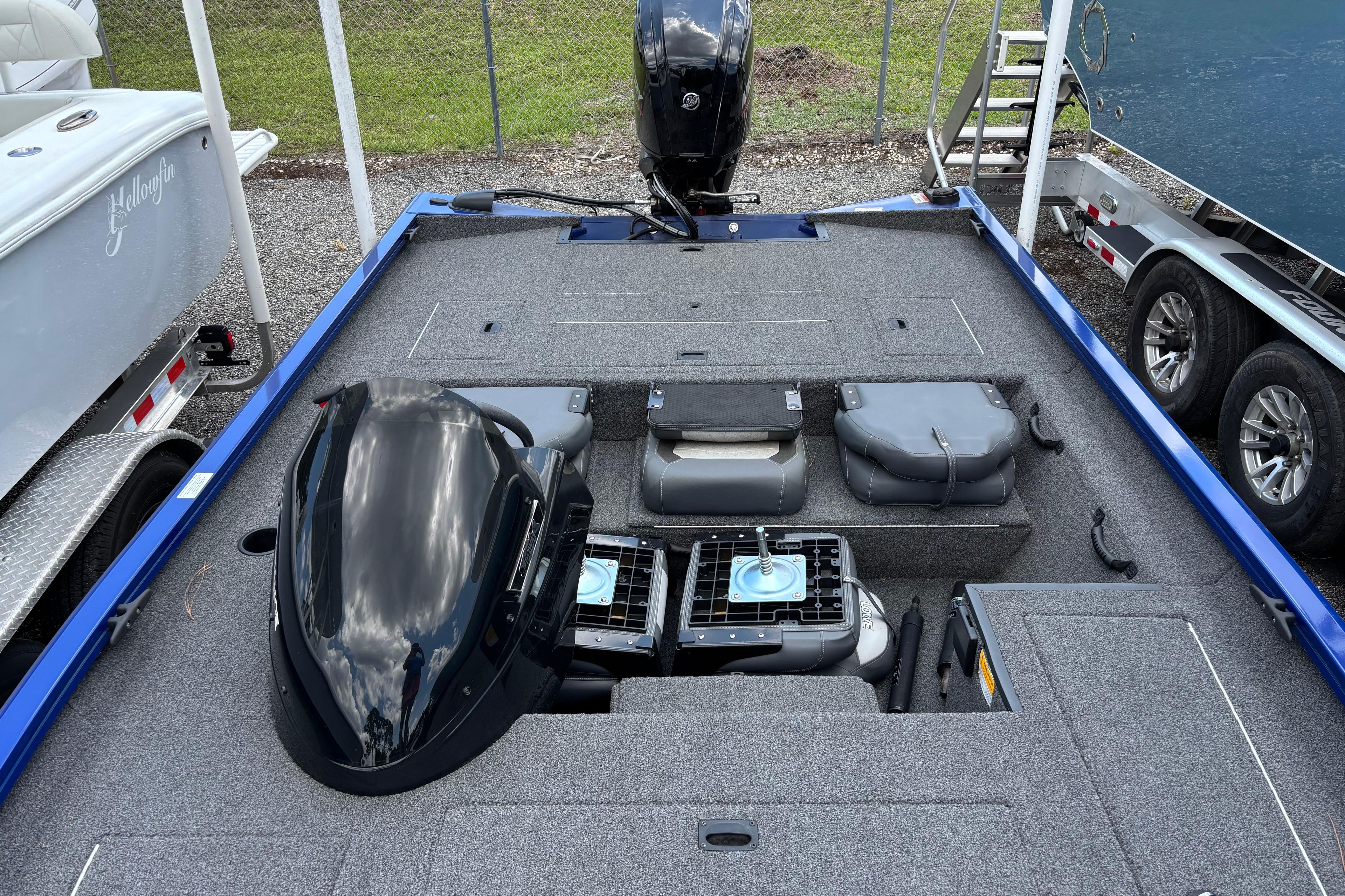 2021 Lowe Stinger 175C boat interior with motor and storage compartments.