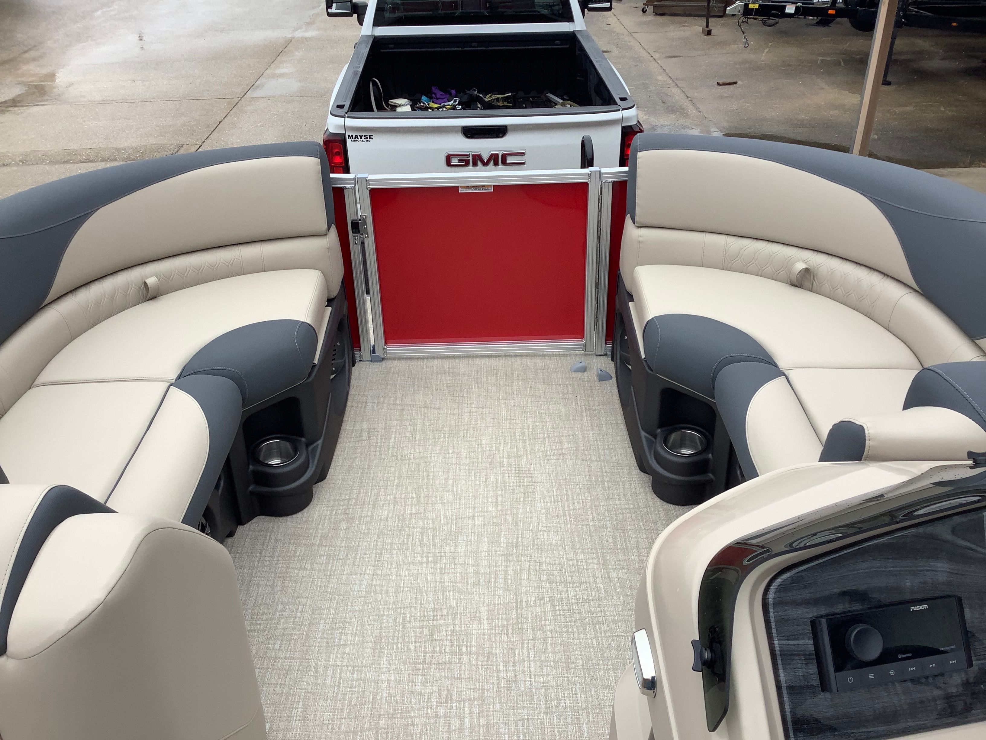 Interior of a 2026 Tahoe 2185 LTZ pontoon boat with luxurious seating.