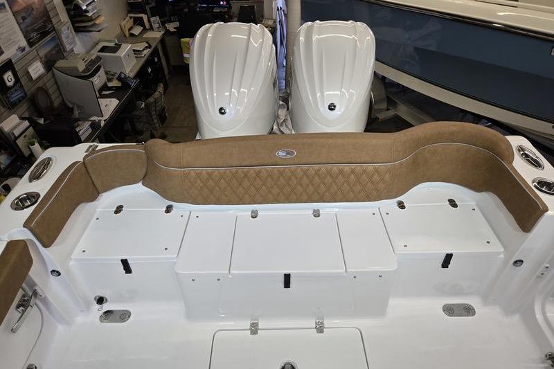 2026 Sea Hunt Ultra 275 Coffin Box boat interior with cushioned seating and storage compartments.