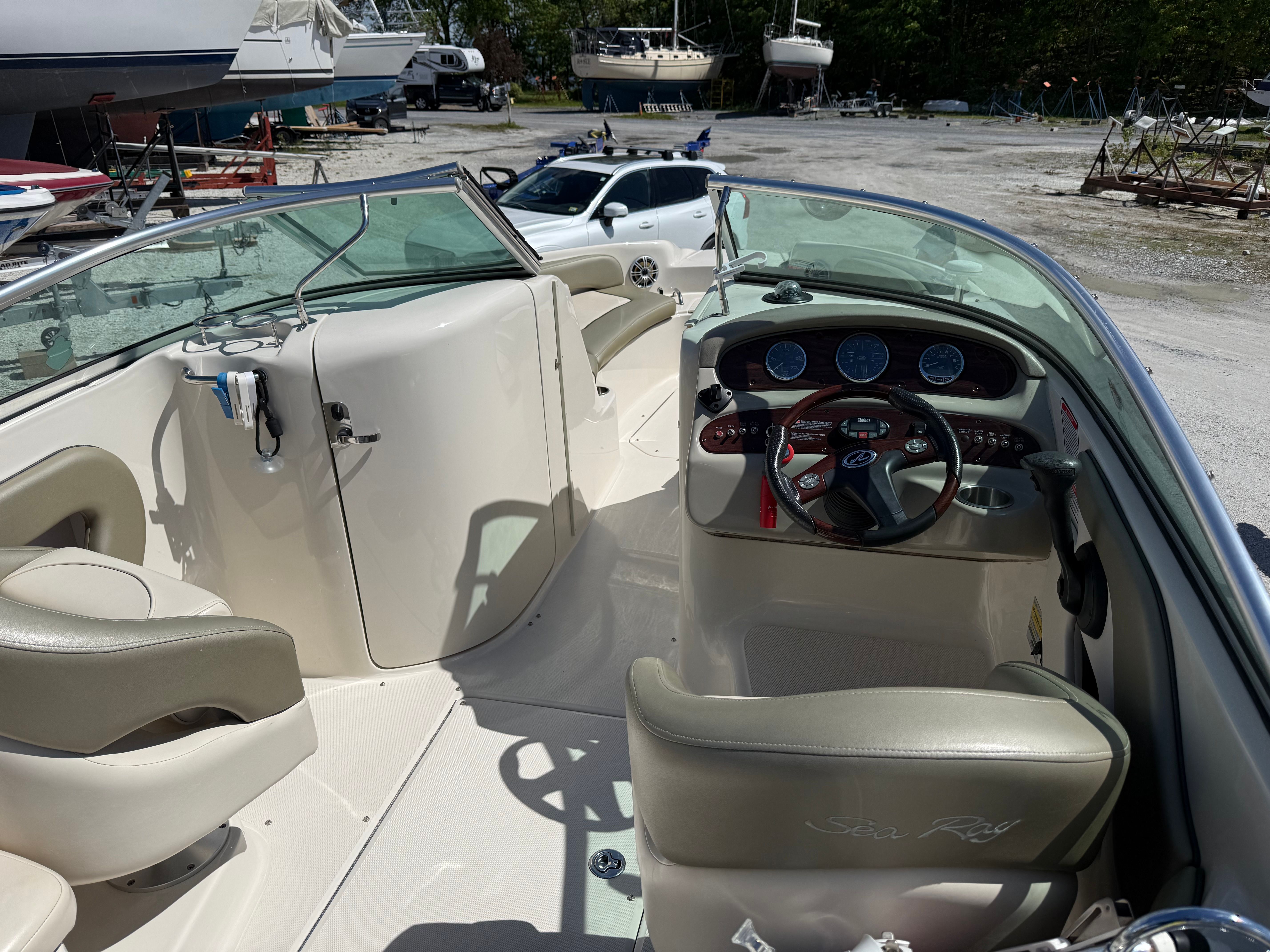 Interior of a 2005 Sea Ray 240 Sundeck boat at the marina.