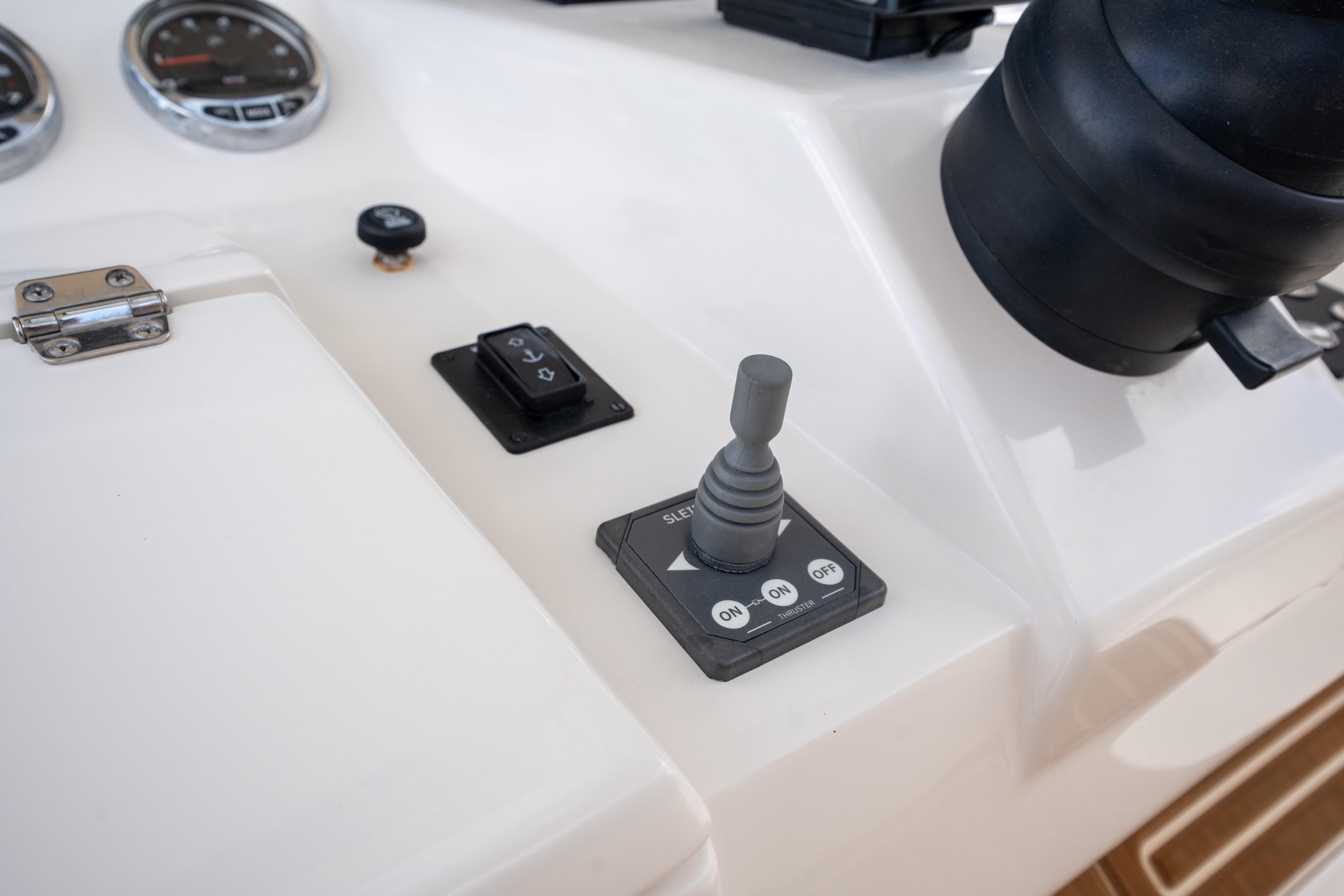Control panel of 2026 Blackwater 41 Performance Fish boat with joystick and switches.