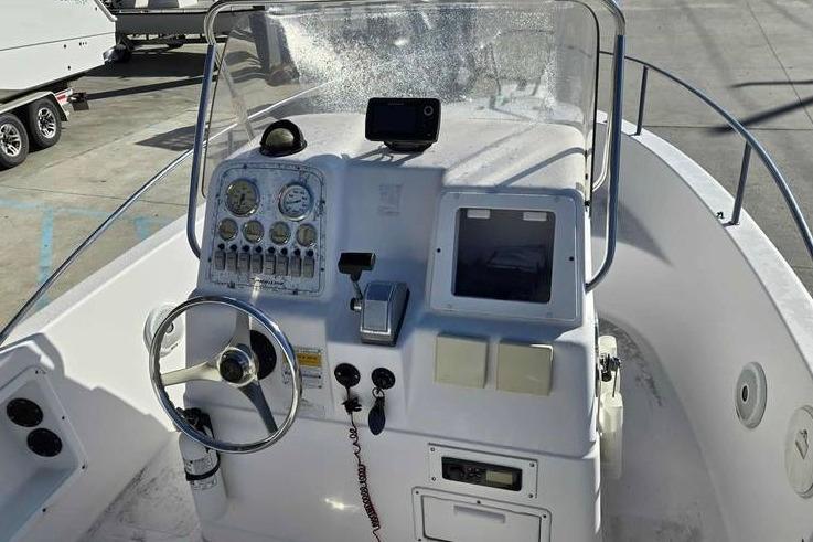 2001 Pro-Line 19 Sport boat dashboard with steering wheel and control panel.
