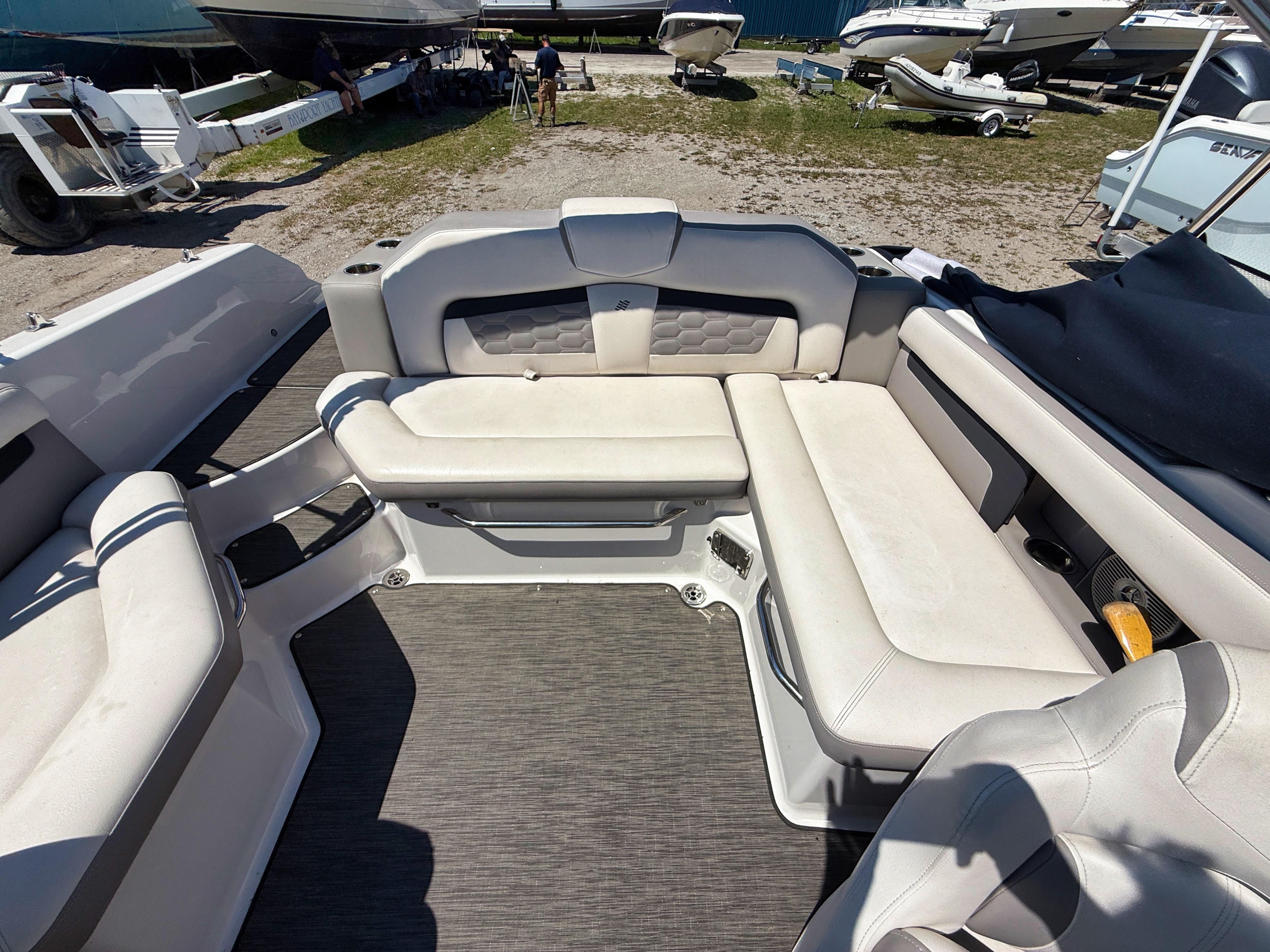 Interior of a 2017 Four Winns HD220 boat with white seating.