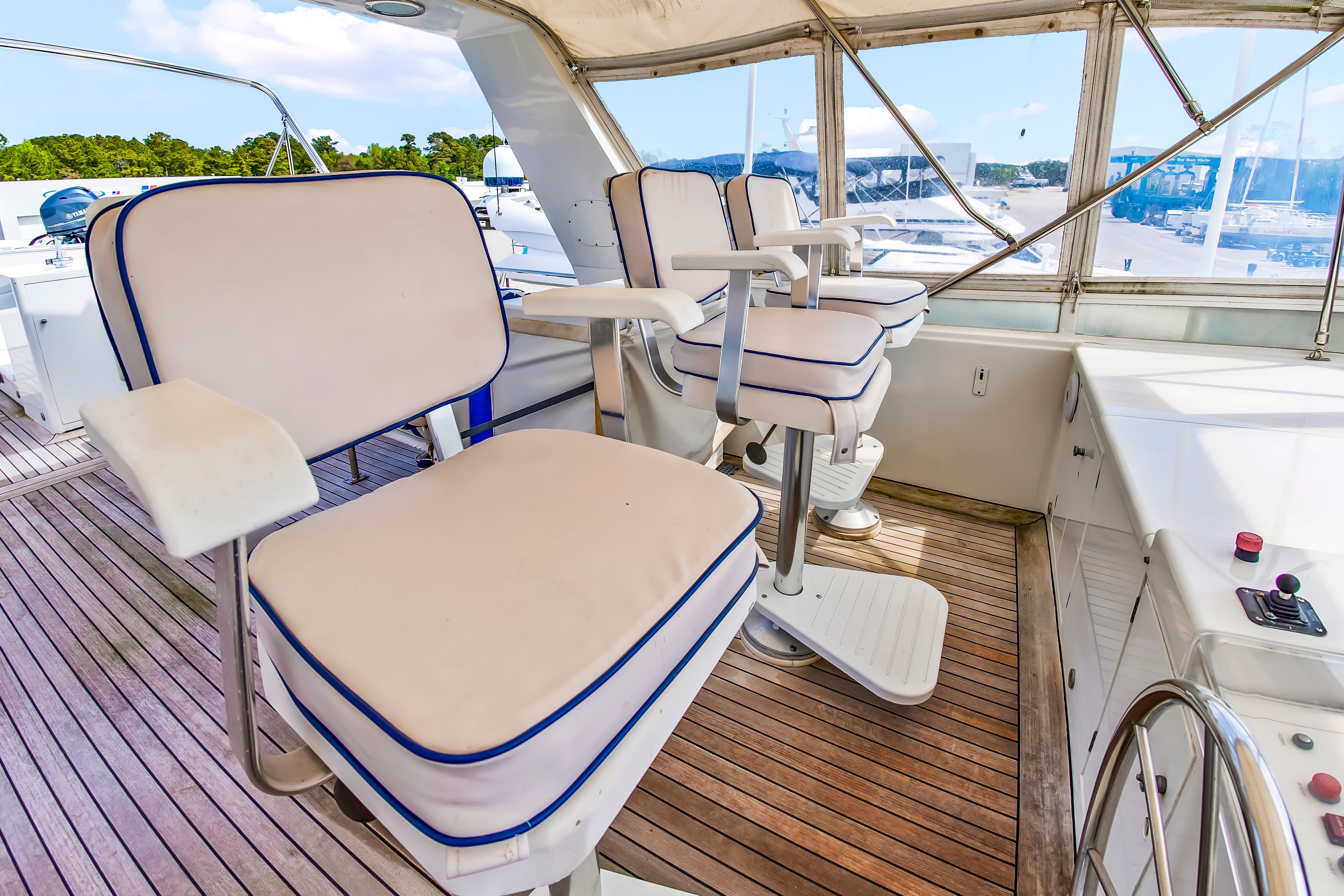 The image shows the deck of a 1987 Jongert 78 Motor Yacht with cushioned seats.