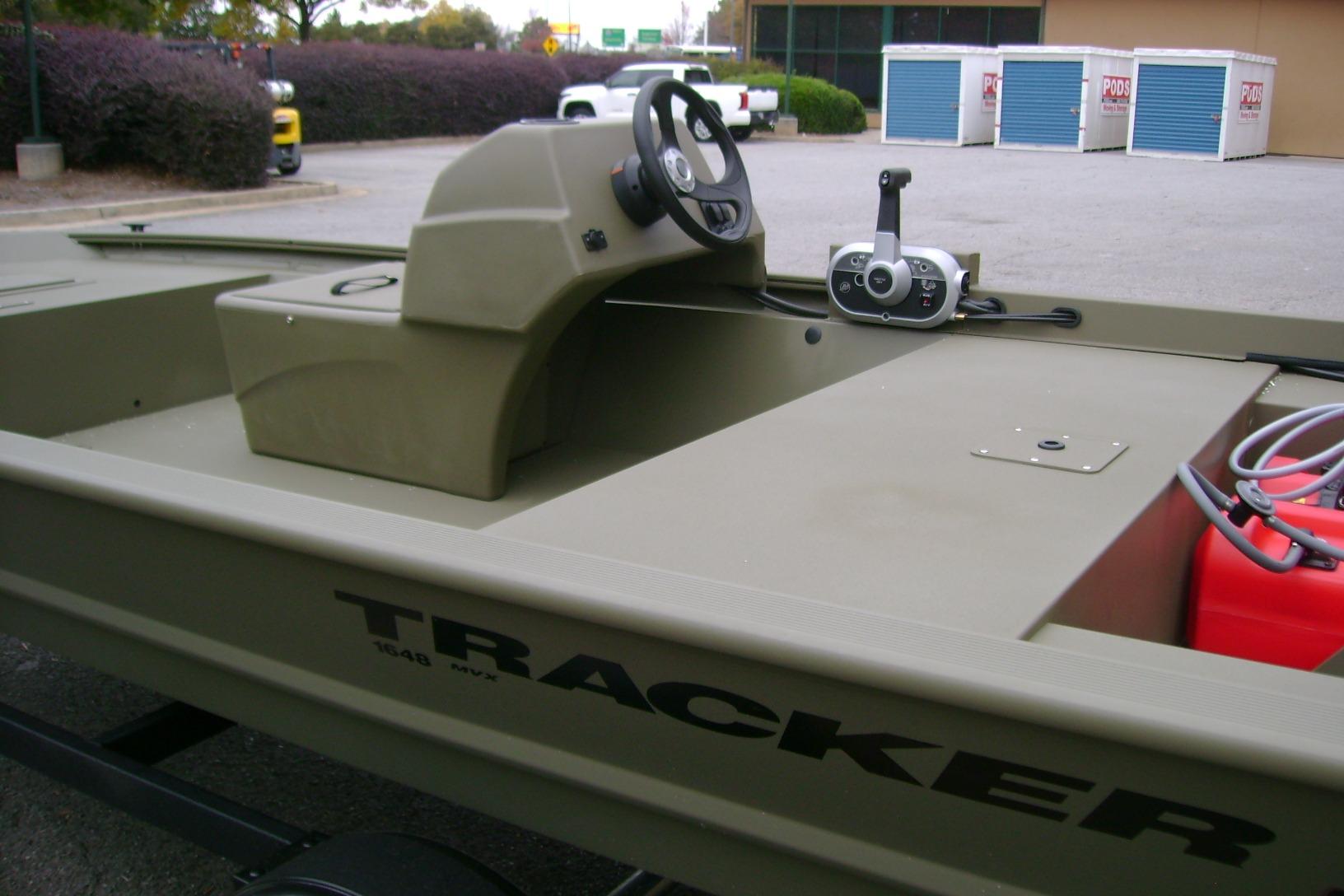 2026 Tracker Grizzly 1648 SC boat with steering console and control panel.