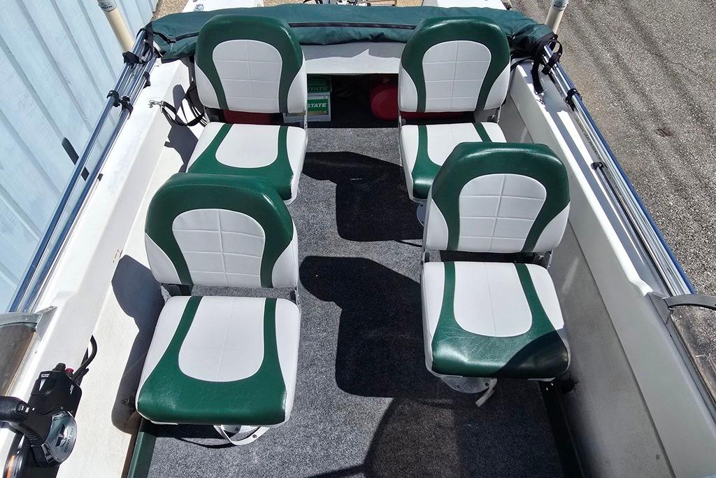 1971 Jupiter 15' Tri Hull boat interior with green and white seating arrangement.