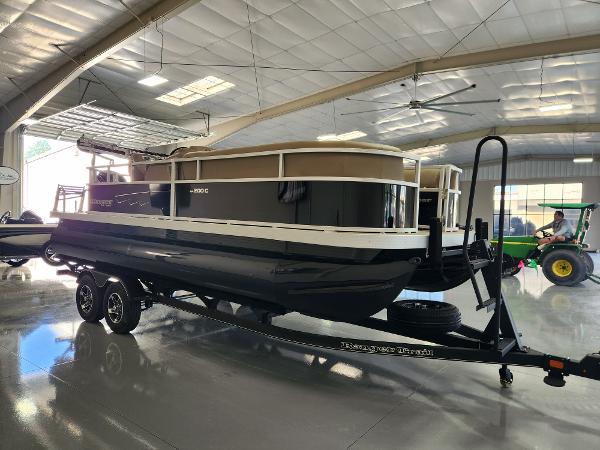 2025 Ranger 200C pontoon boat on trailer in indoor showroom.