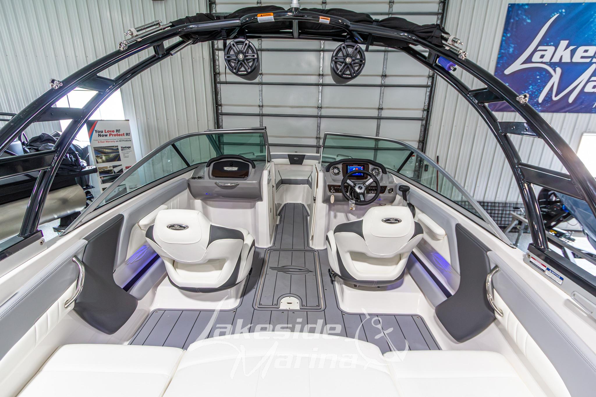 Interior view of 2022 Chaparral 21 SSi boat, featuring modern seating and dashboard.