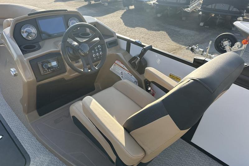 Cockpit of 2026 Evotti 523CS boat with steering wheel and control panel.