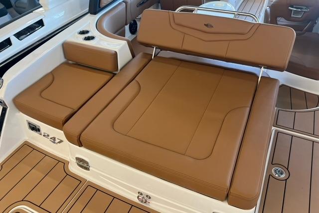 2025 Chaparral 247 SSX boat with luxurious brown seating and sleek design.