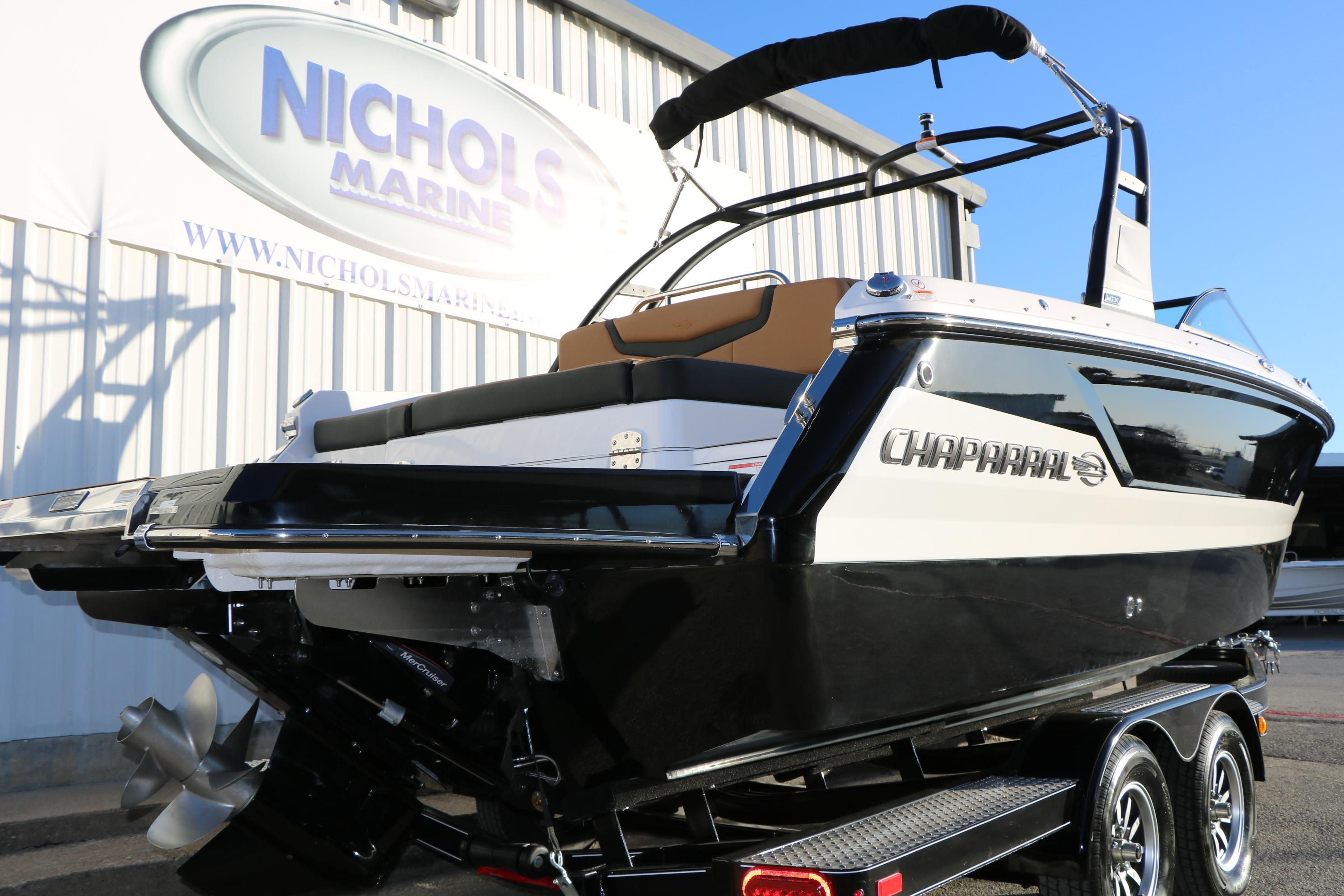 2026 Chaparral 247 SSX boat on trailer at Nichols Marine dealership.