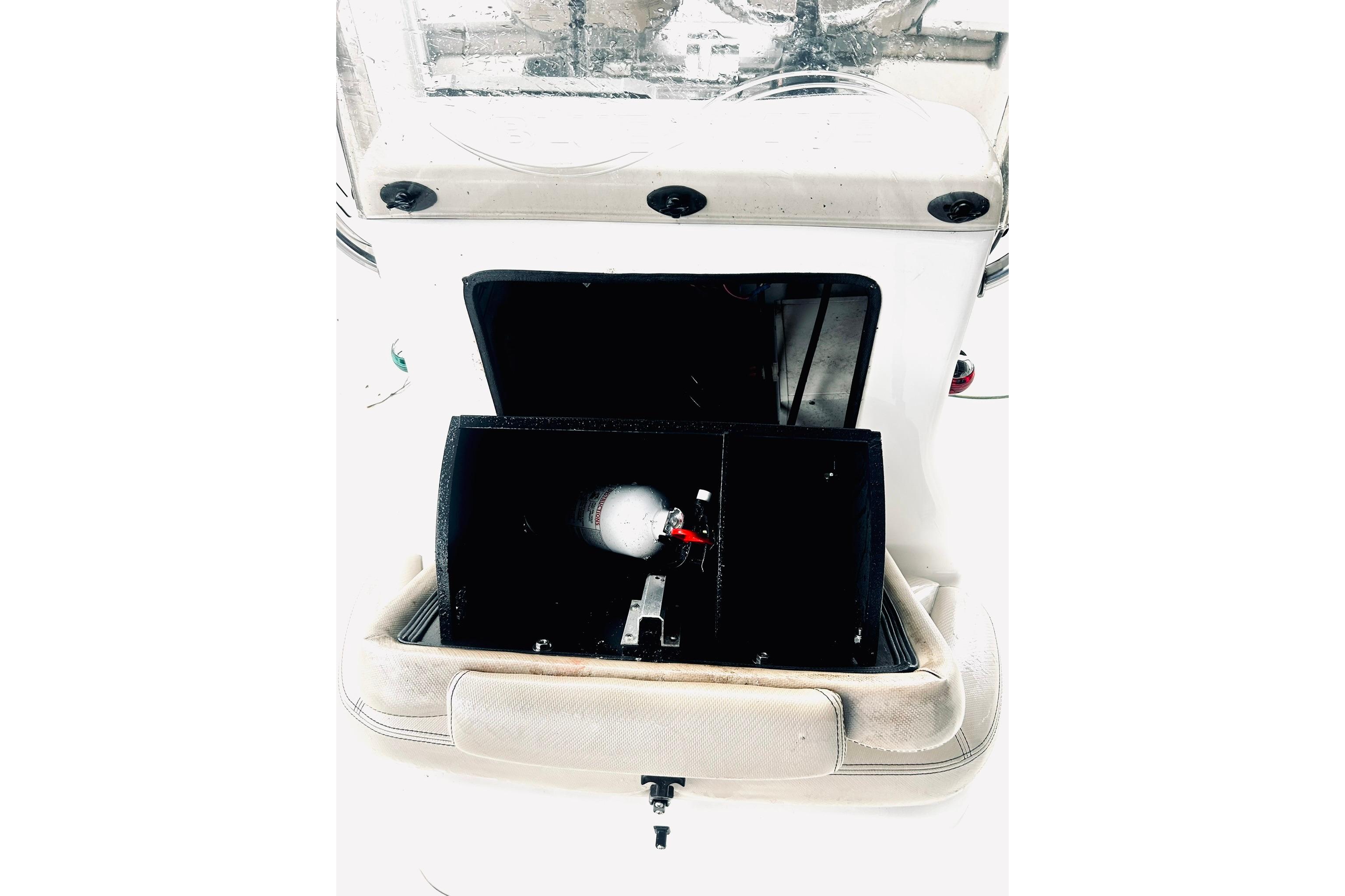 2017 Blue Wave 2200 PureBay boat console with open storage compartment.