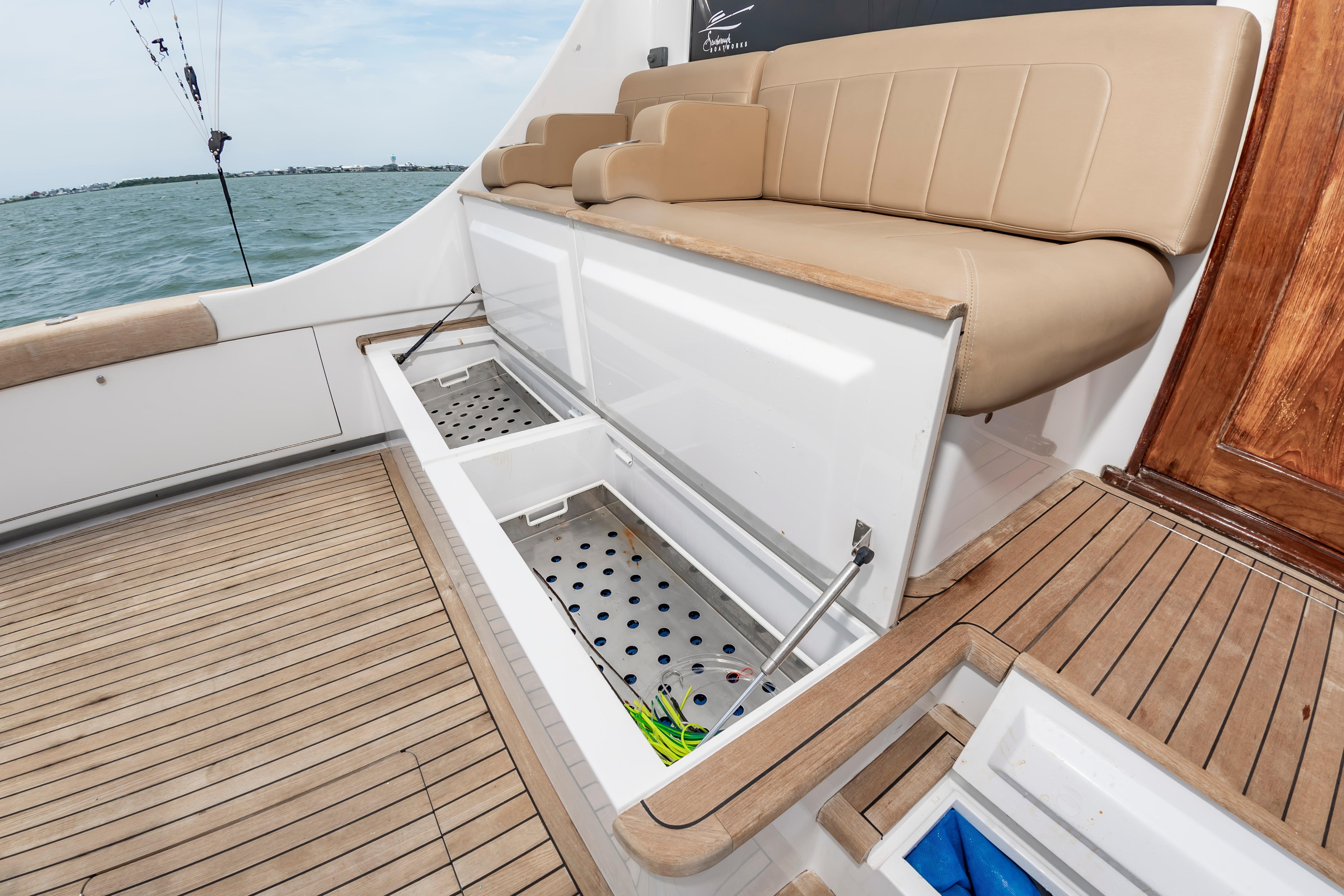 Luxury seating and storage on 1993 Custom Carolina Scarborough 56 Convertible yacht deck.