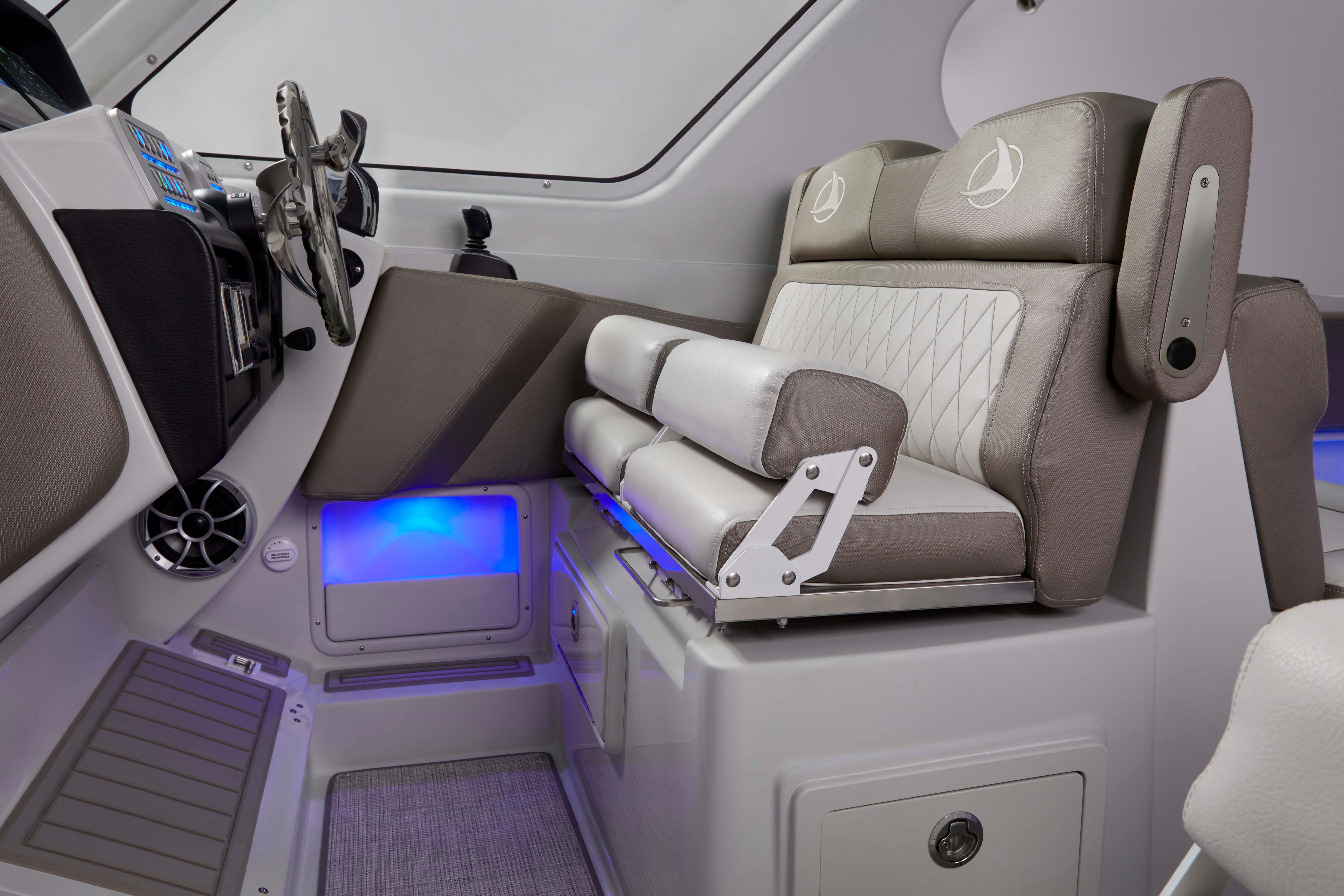 2024 Finseeker 280 DC boat interior with modern seating and illuminated dashboard.