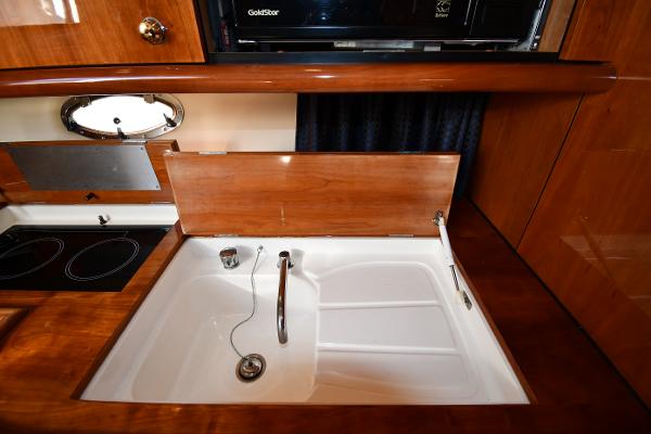 Luxurious kitchen sink area in a 1997 Sunseeker Camargue 47 yacht.