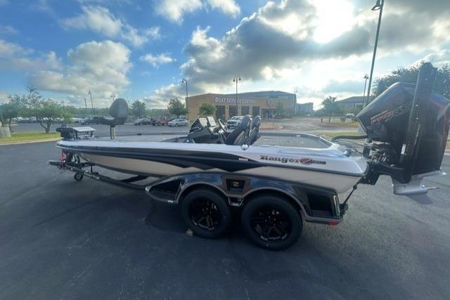 2026 Ranger Z521R boat parked outdoors under a partly cloudy sky.