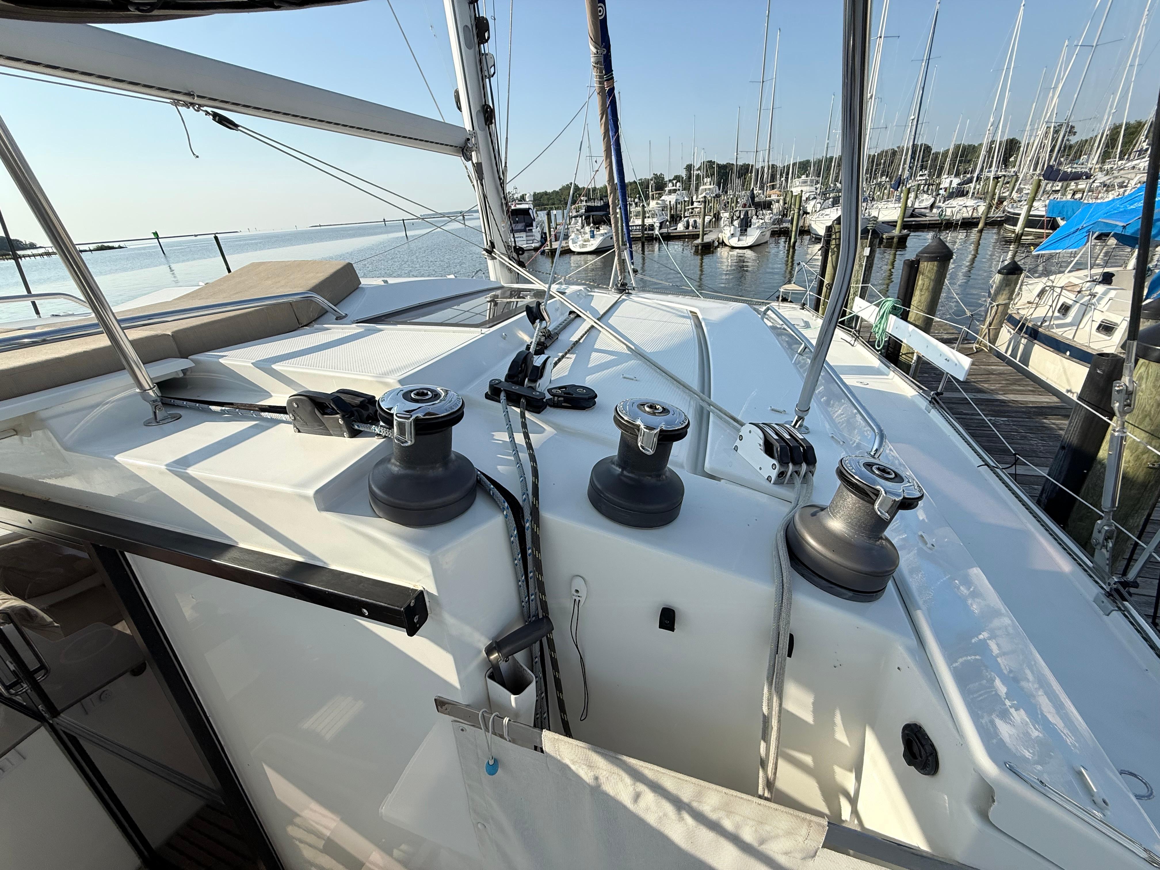 Fountaine Pajot Helia 44 catamaran deck view, 2015 model, docked at marina.