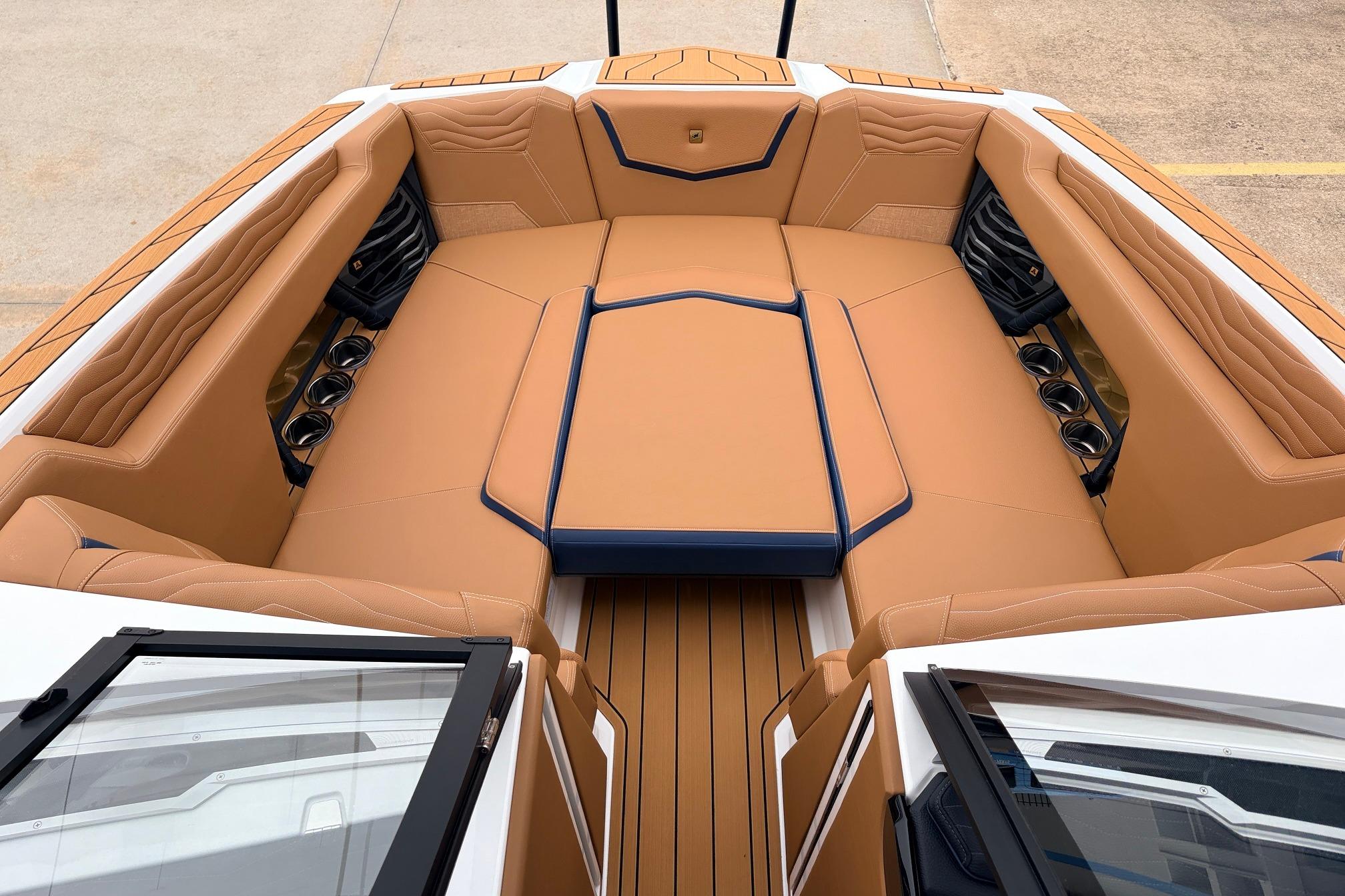 Luxurious interior of 2026 Nautique Super Air Nautique G25 boat with tan seating.