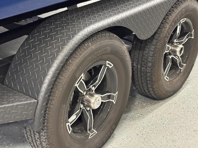 Trailer wheels of a 2026 Chaparral SSX 6 with diamond plate fenders.