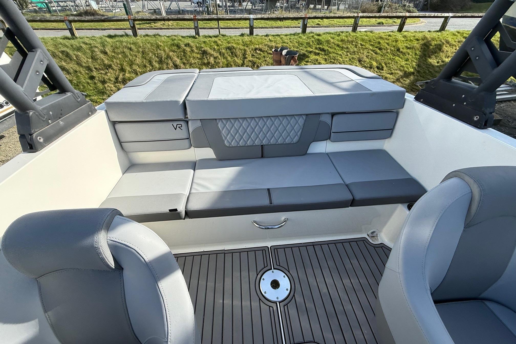 2023 Bayliner VR4 Bowrider I/O interior with gray seating and modern design.