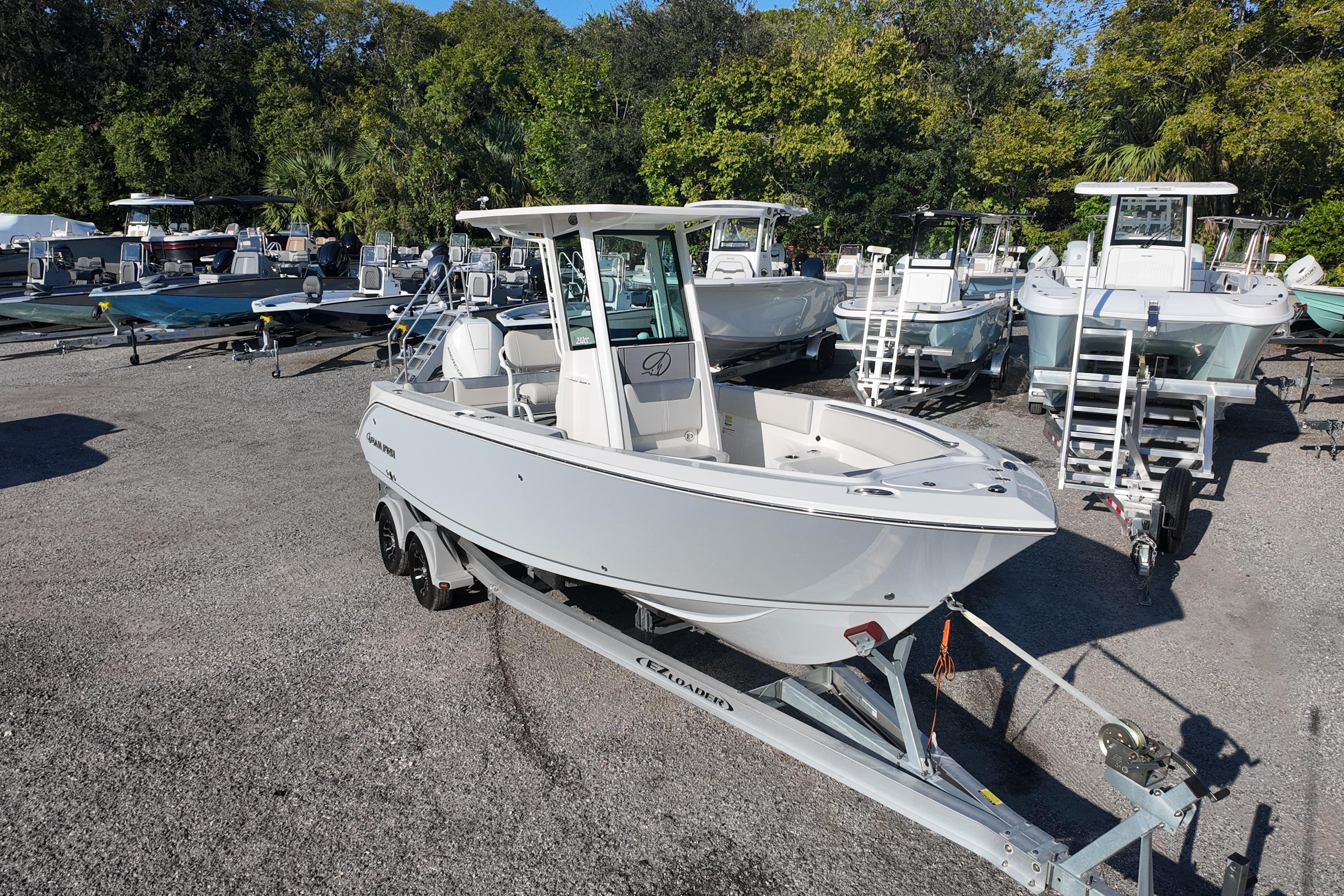 2026 Sailfish 232 CC boat on trailer in outdoor showroom.