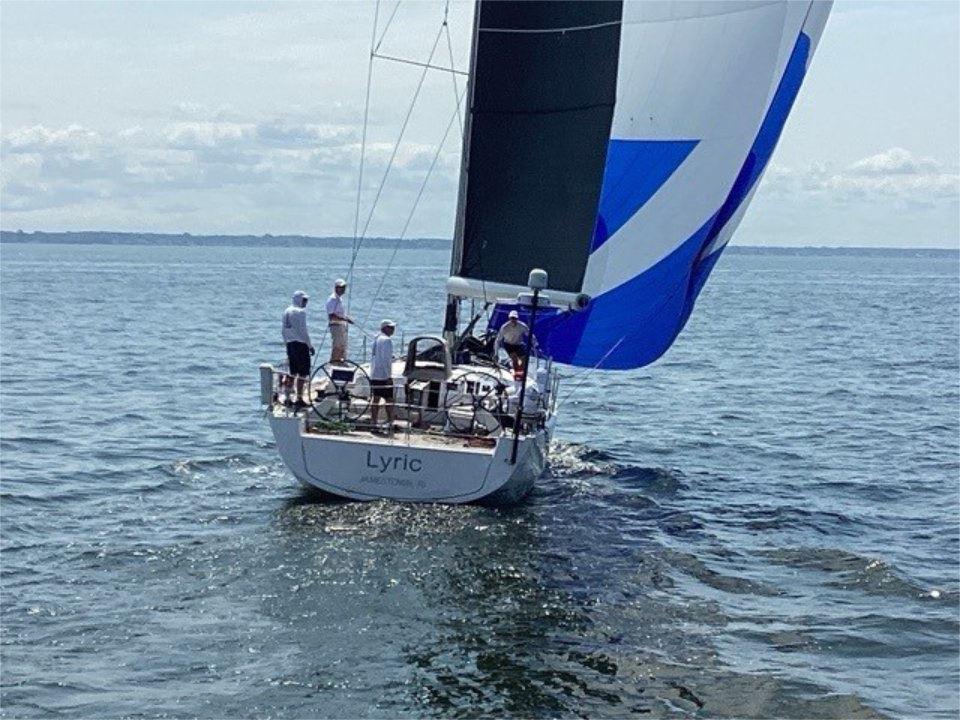 Sailing yacht X-Yachts X4.9, 2018 model, with crew on open sea.