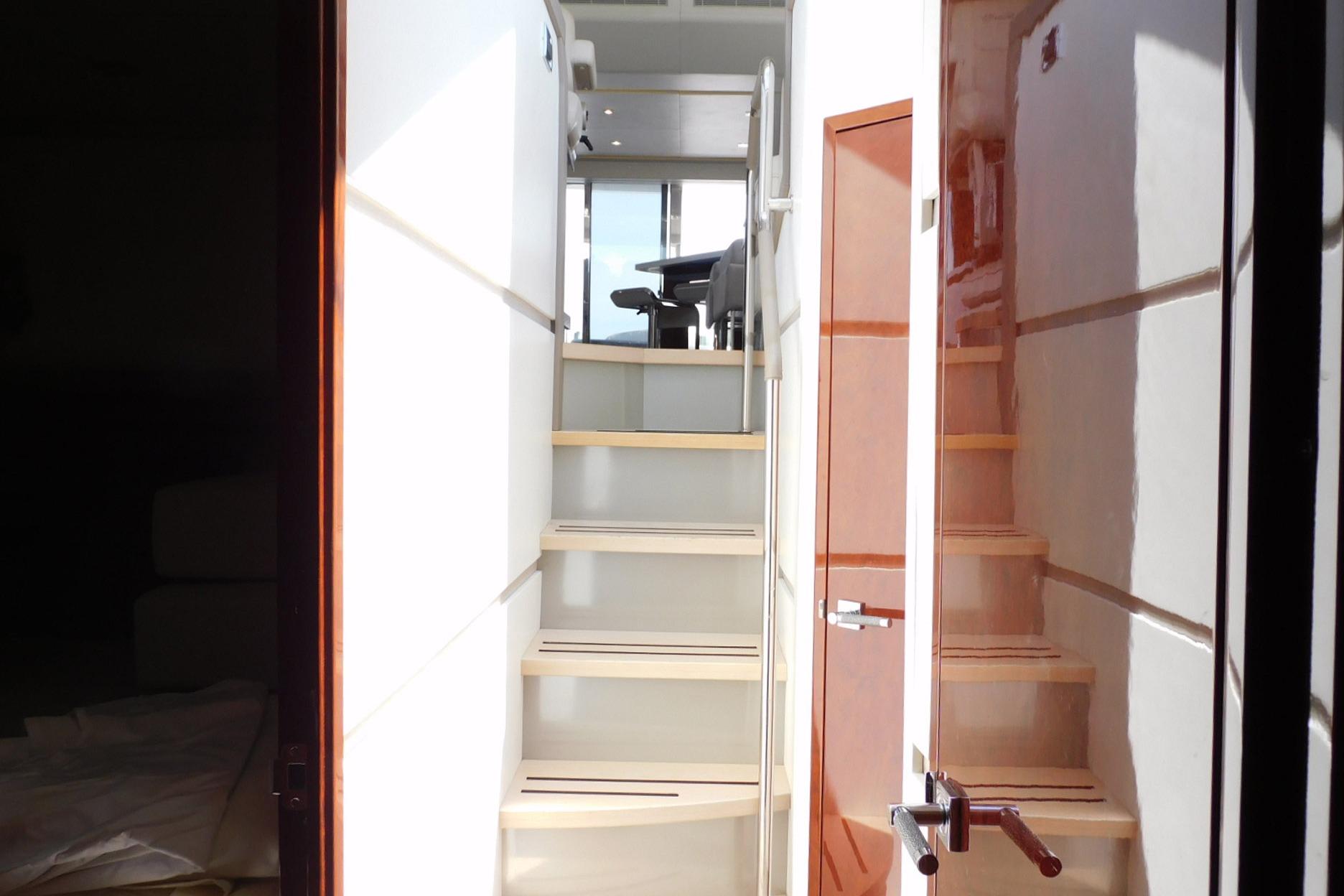 Interior view of 2019 Sea Ray L550 yacht, featuring sleek stairs and modern design.