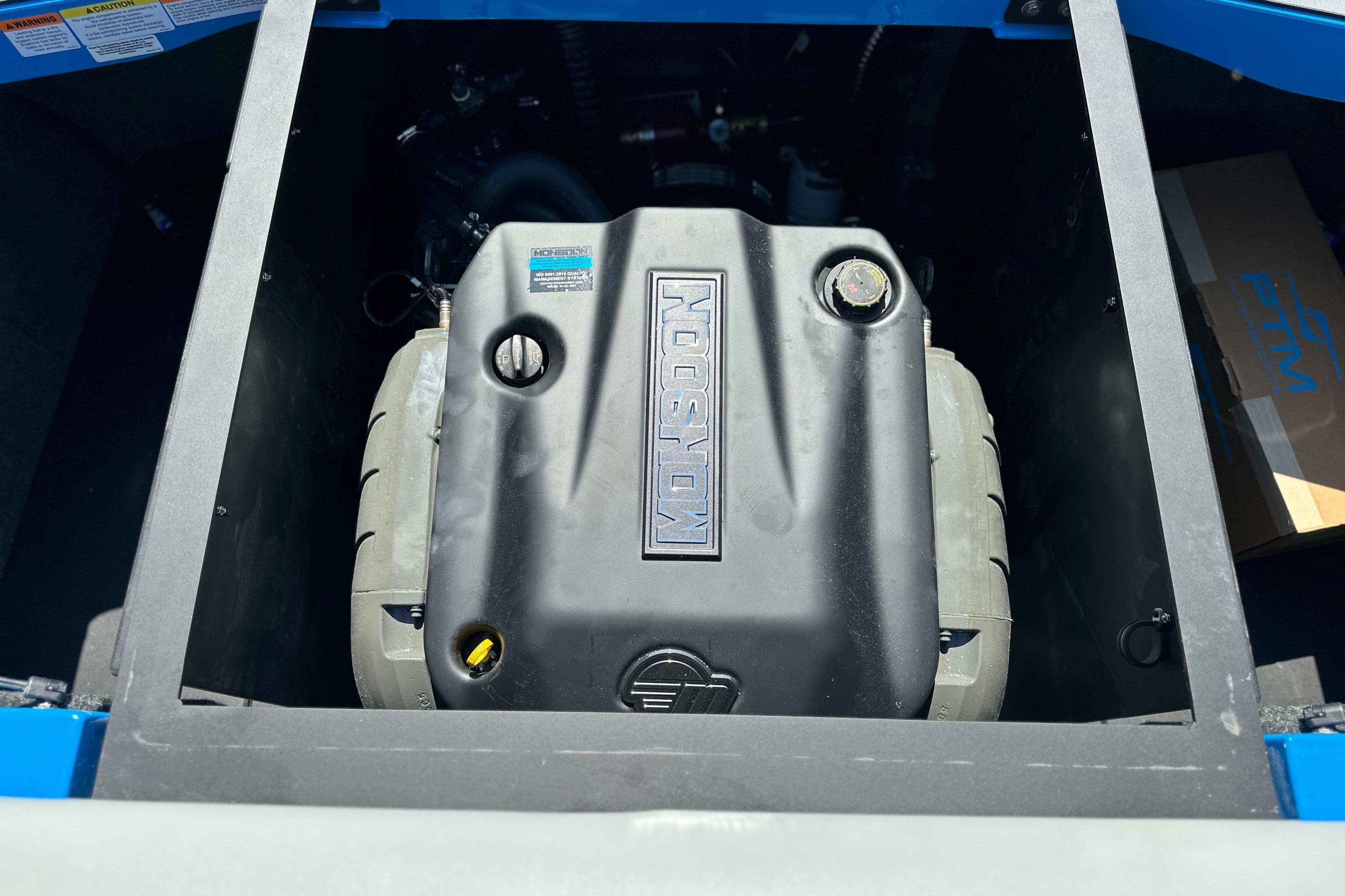 Engine compartment of 2026 Axis T235 boat, featuring a Monsoon engine.
