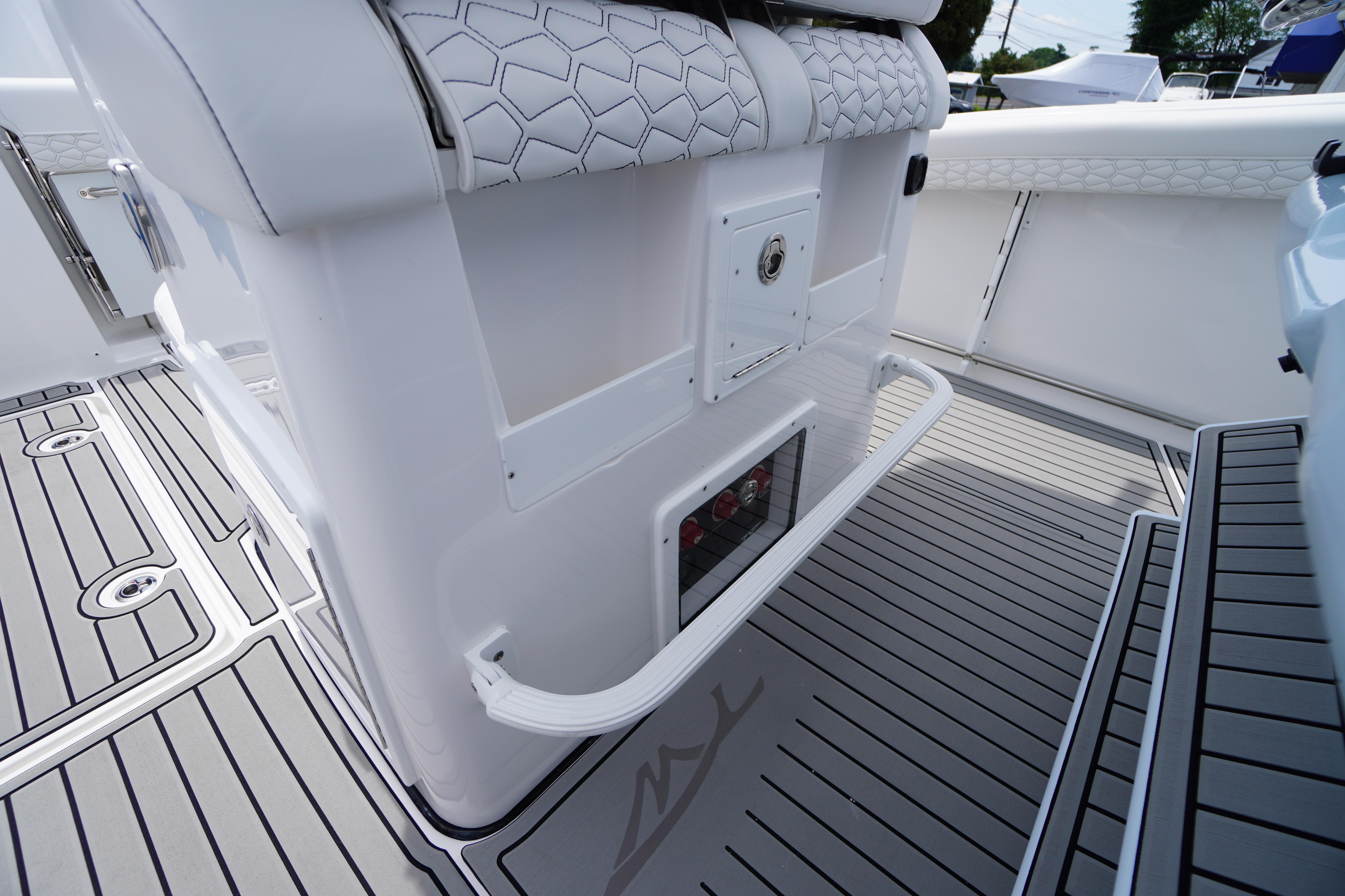 2026 Tidewater 282 CC Adventure boat interior with sleek seating and modern flooring design.