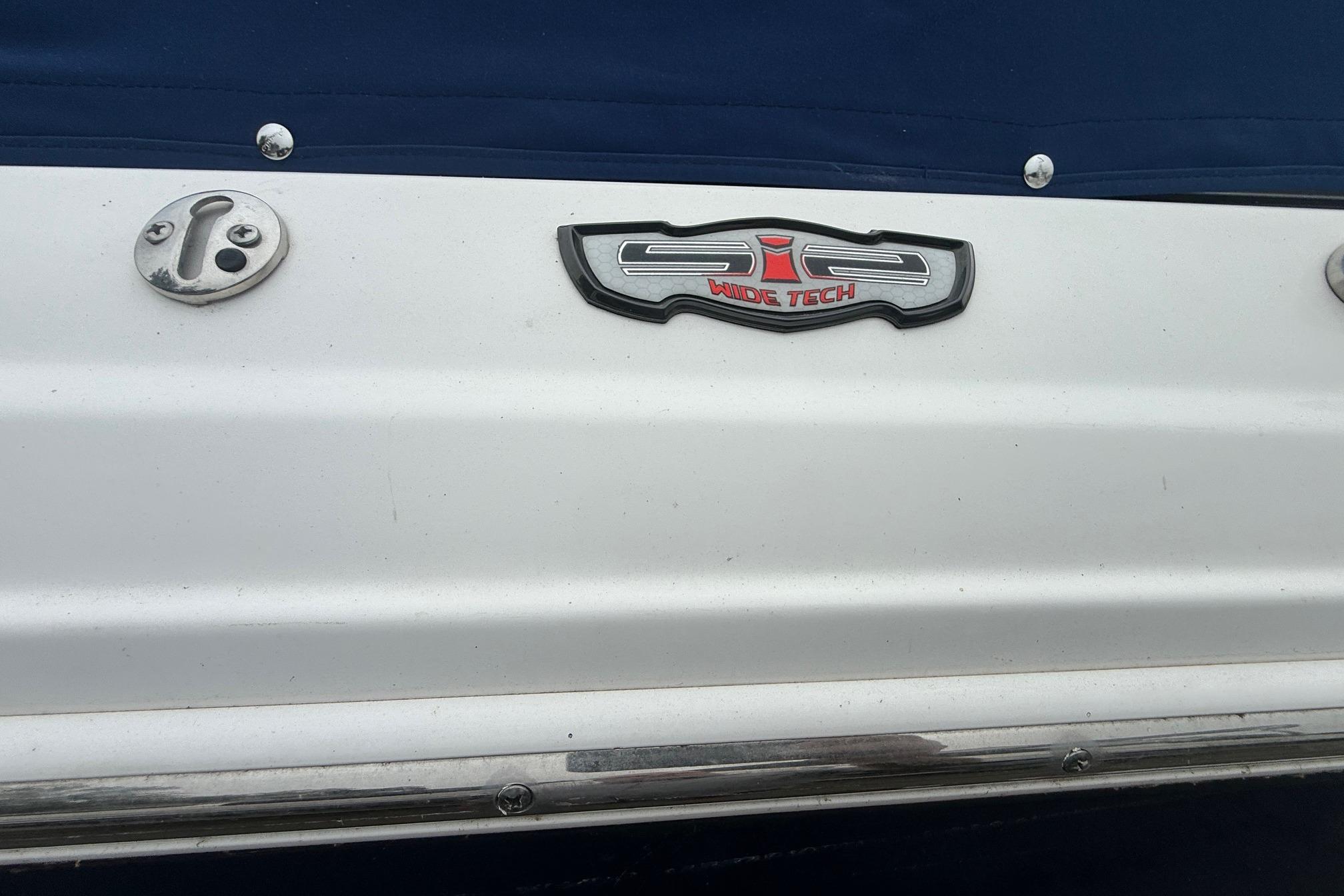 2016 Chaparral 226 SSi Wide Tech boat emblem on white surface.