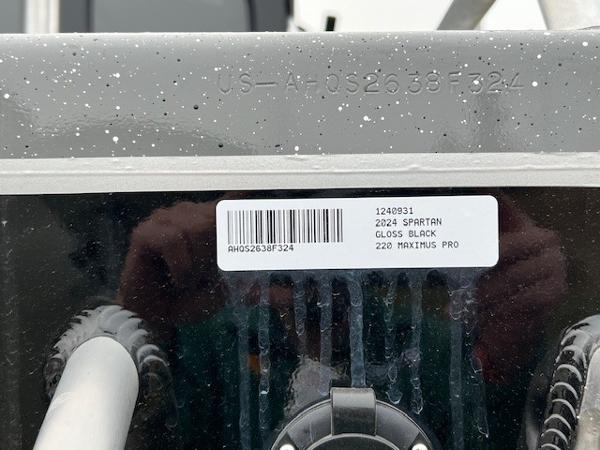 2024 Spartan 220 Maximus Pro, gloss black, with visible serial number and barcode.